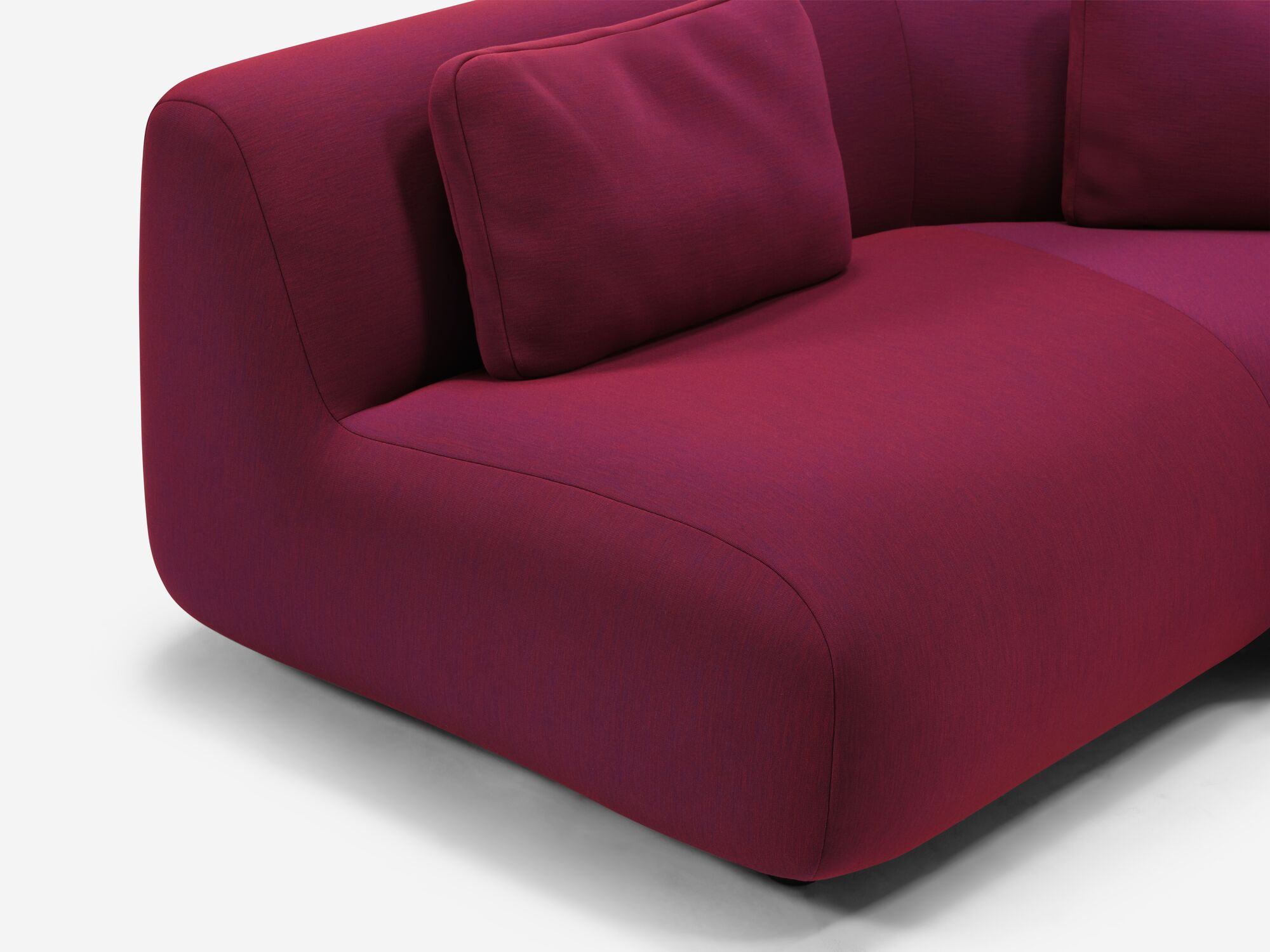 Red purple curved sofa seat detail view