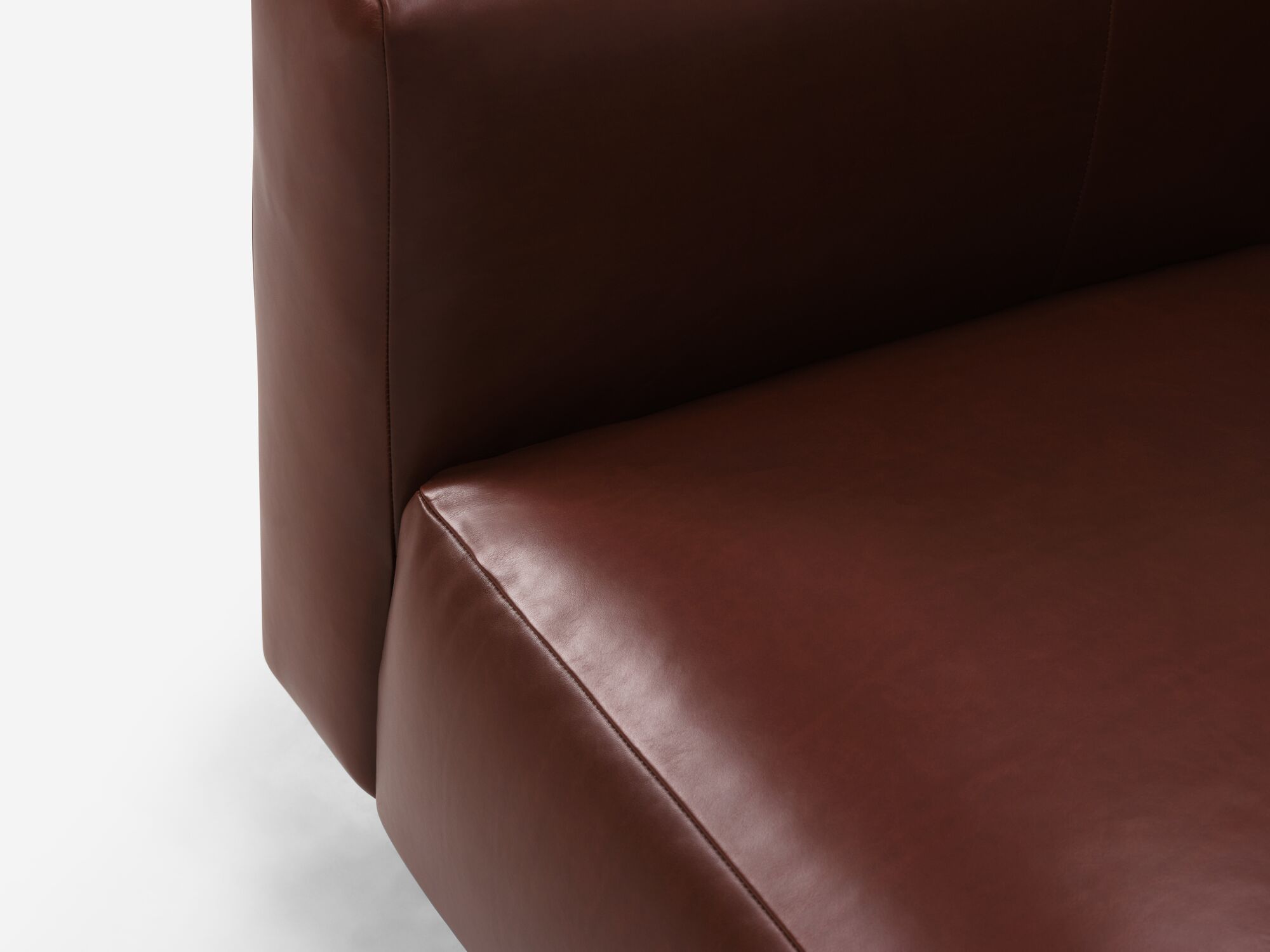 Seat detail view of dark brown leather sofa