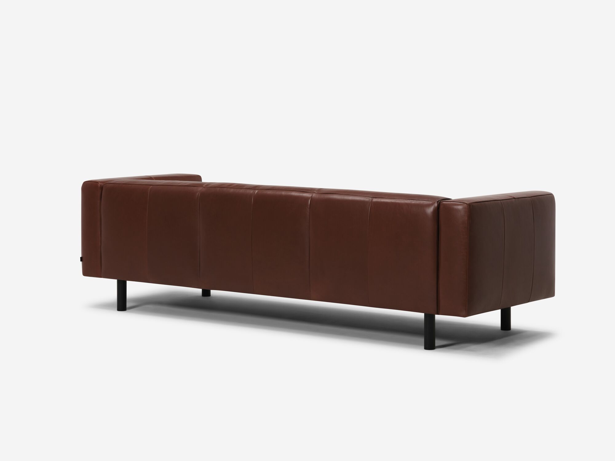 Back angle view of dark brown leather sofa