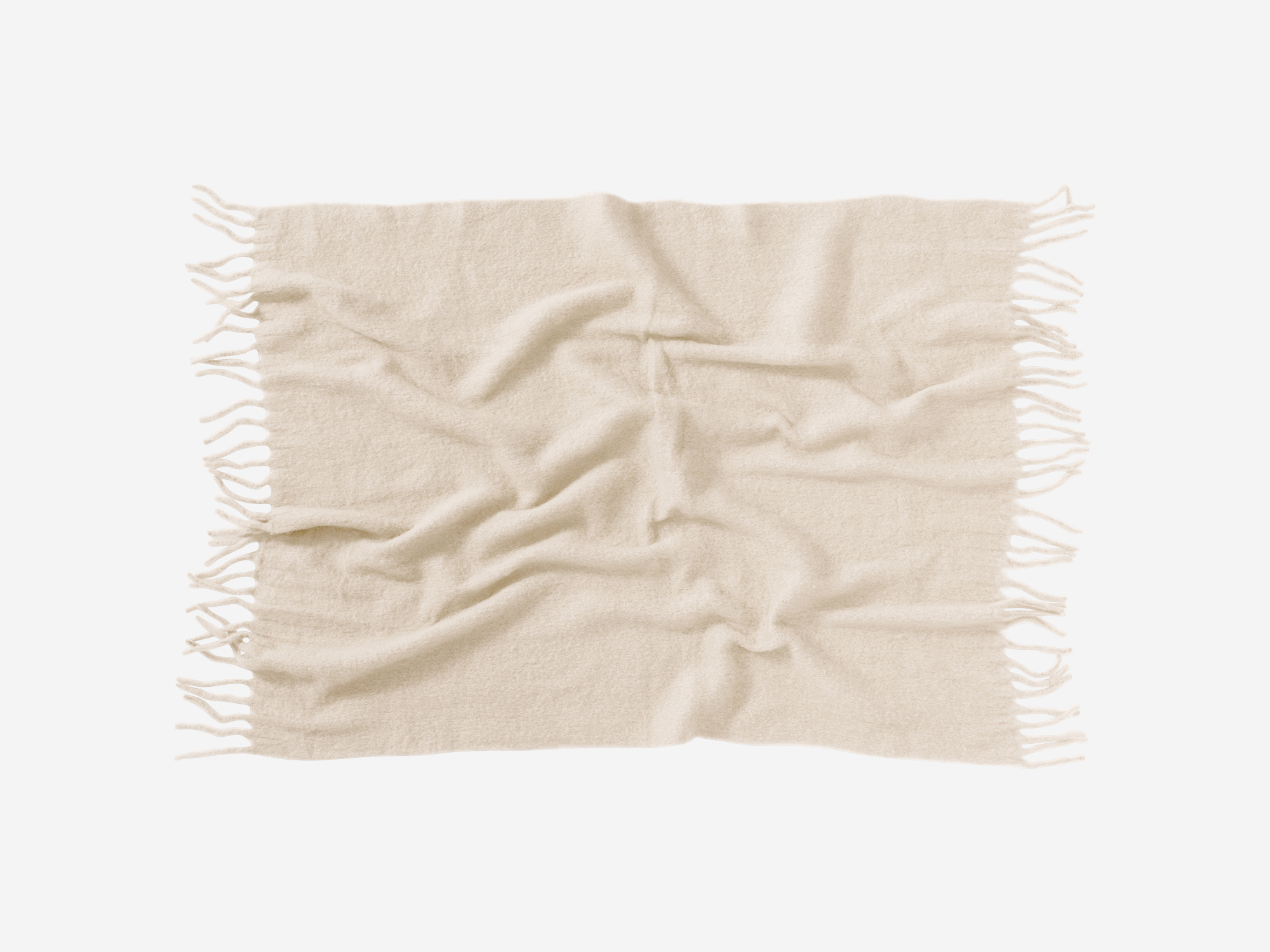 Top view of wrinkled ivory wool throw with tassels