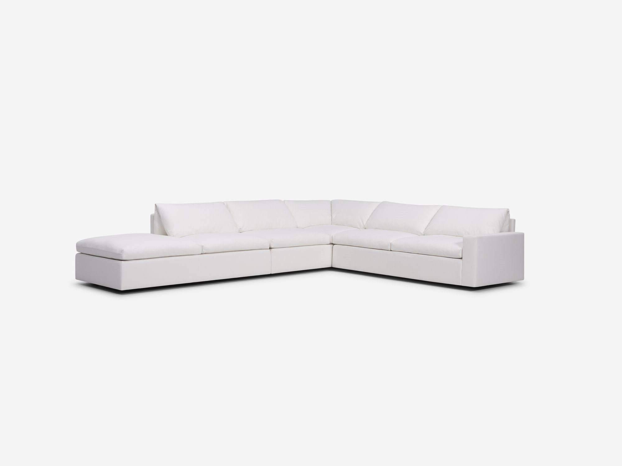 Left angle view of white sectional sofa with left hand chaise