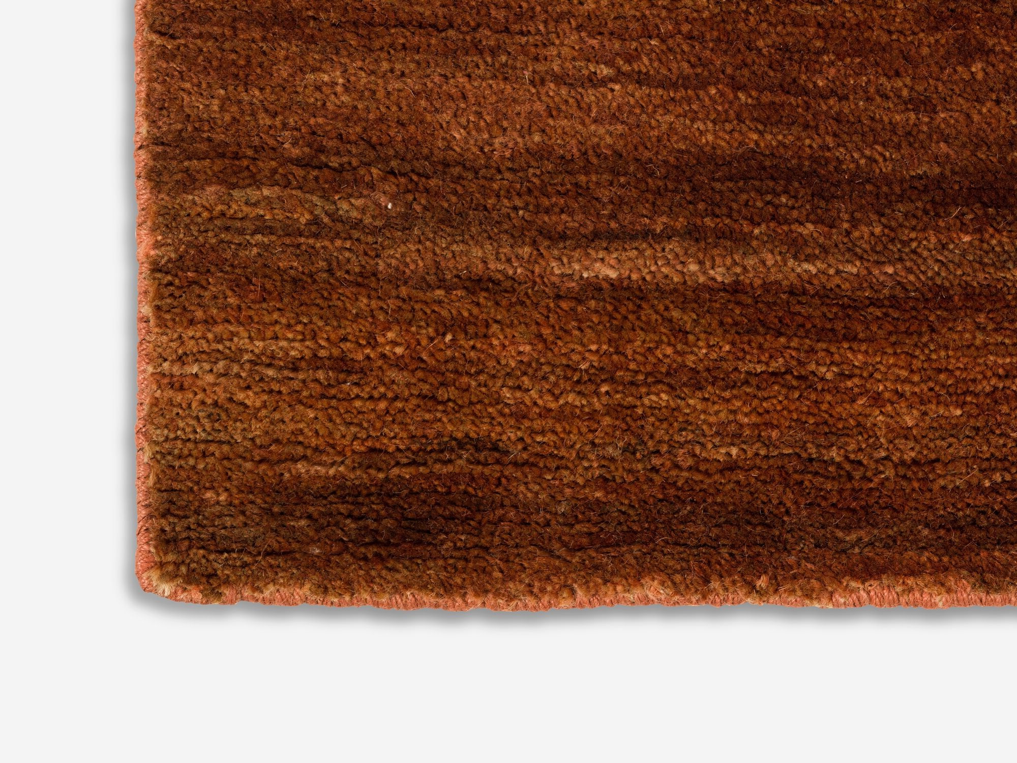 detail view of a rust colour living room rug