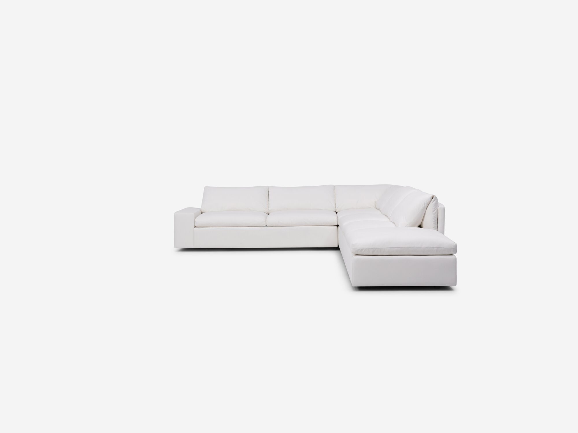White sectional sofa with right hand chaise and wide arms front view