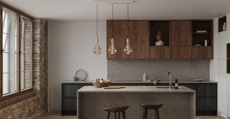 three brass pendants with tala light bulbs are shown in a modern kitchen. Link to tala brand category