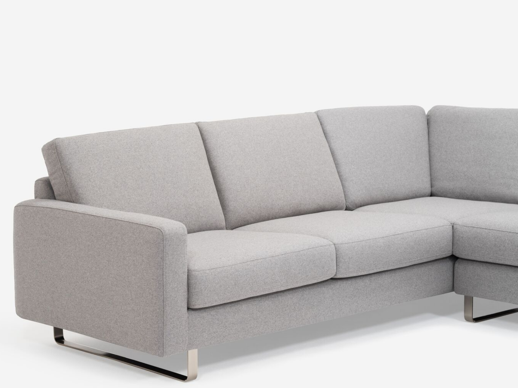 Left arm detail view of grey 2-piece sectional sofa