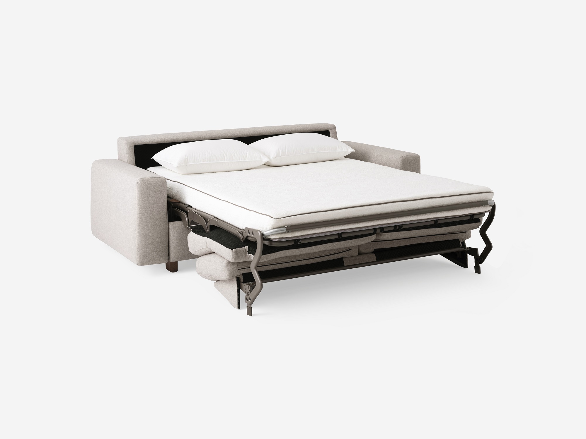 Angled view of the Reva modern sleeper sofa in beige fabric with bed unfolded