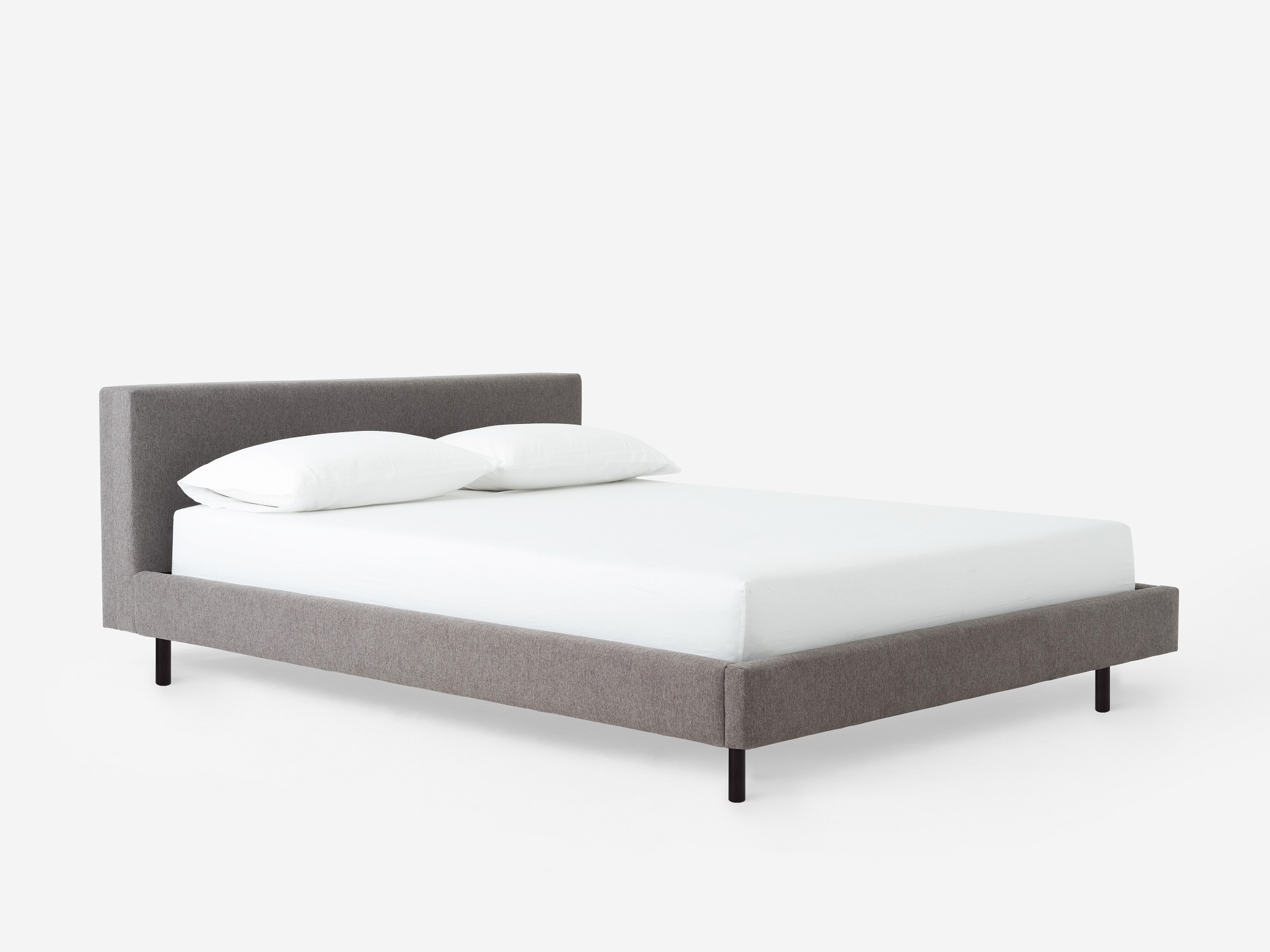 Angled view of the Bento platform bed frame in grey fabric