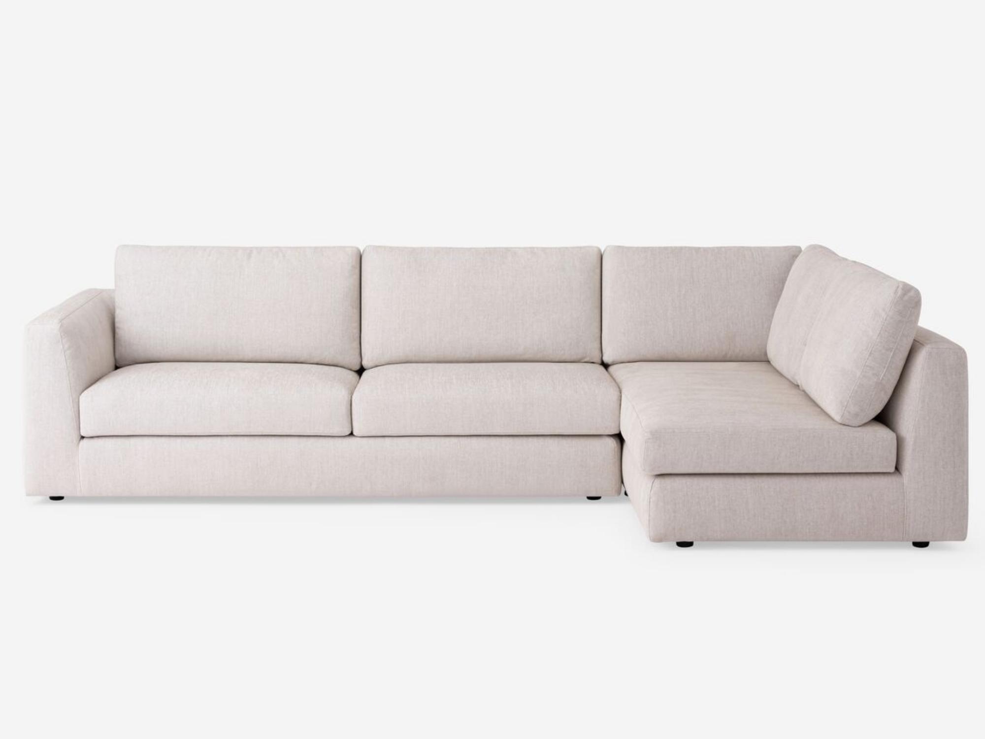 Front view of the Cello modular sofa in white fabric with right hand chaise