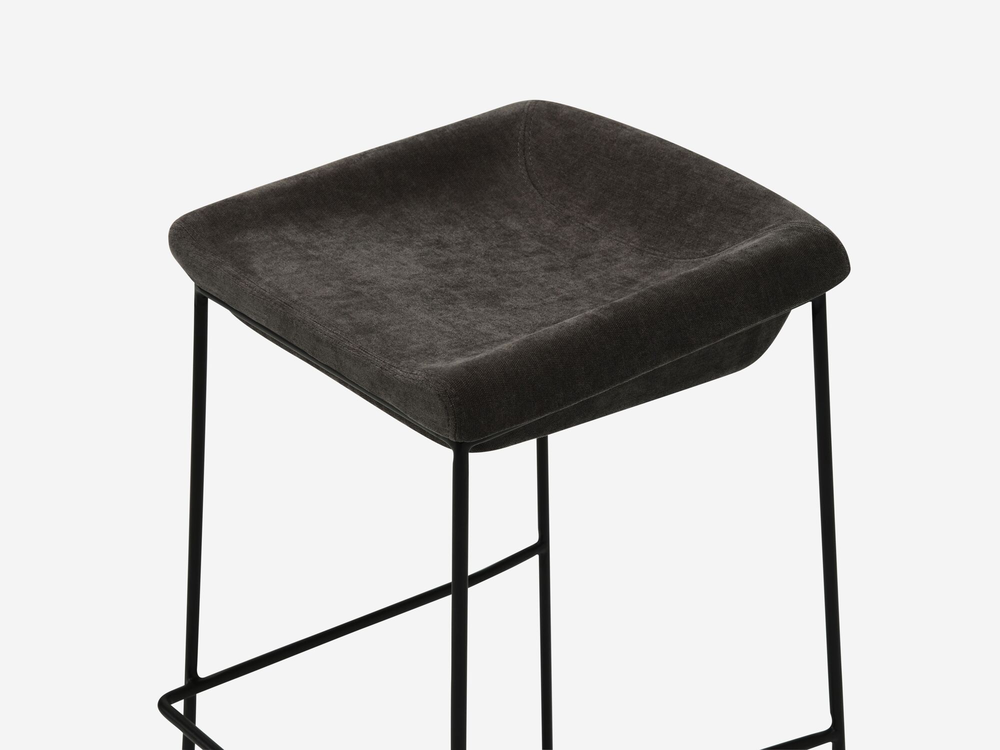 Counter stool with black seat and black legs detail view