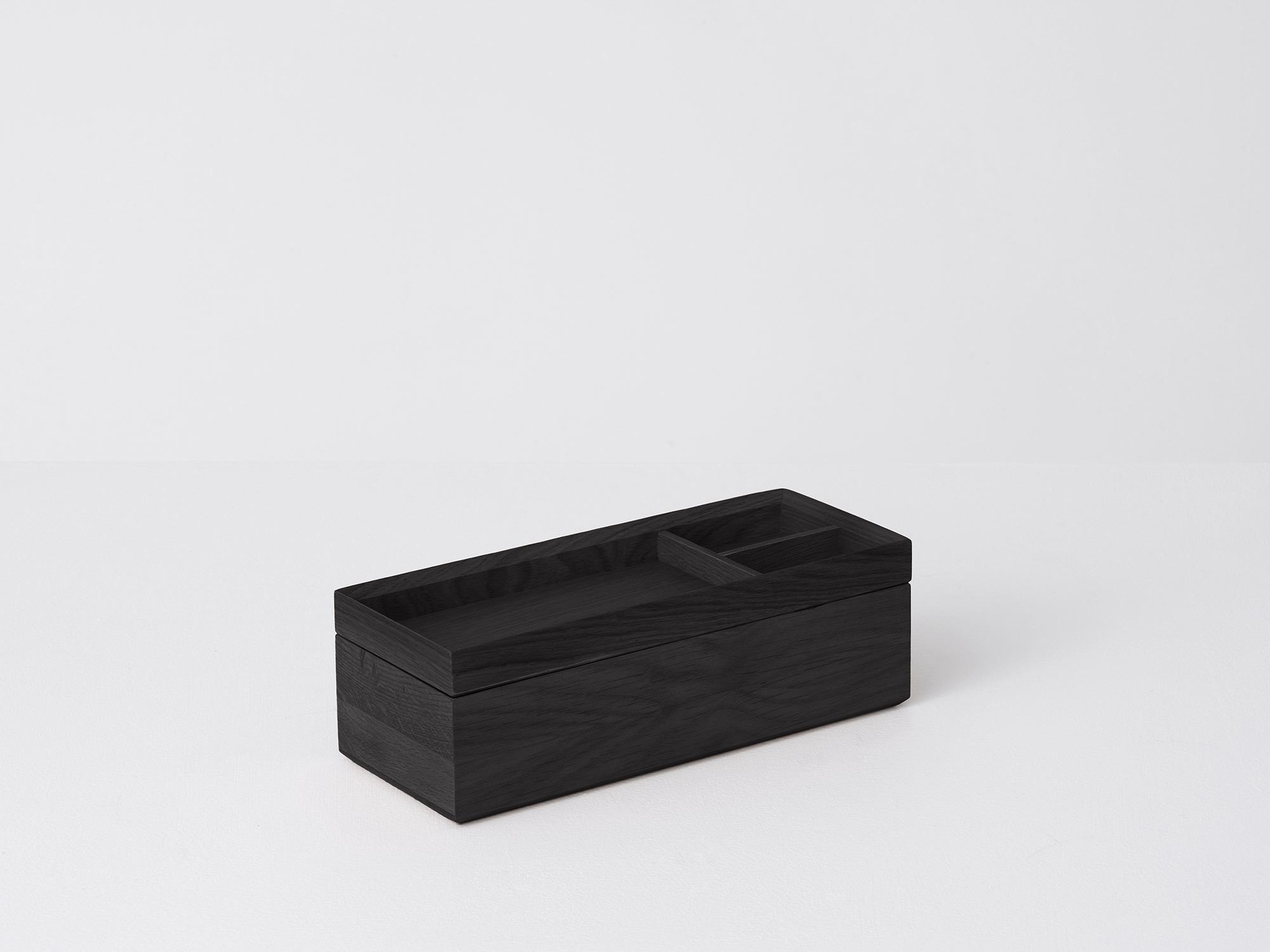 Angled view of the large Draft Pencil Box in black oak