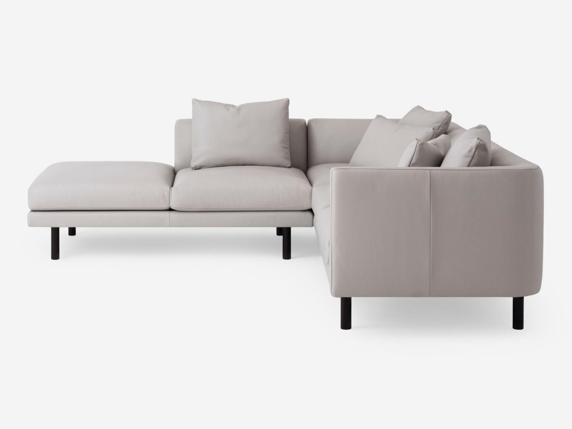 Side view of the Replay modern sectional upholstered in white leather