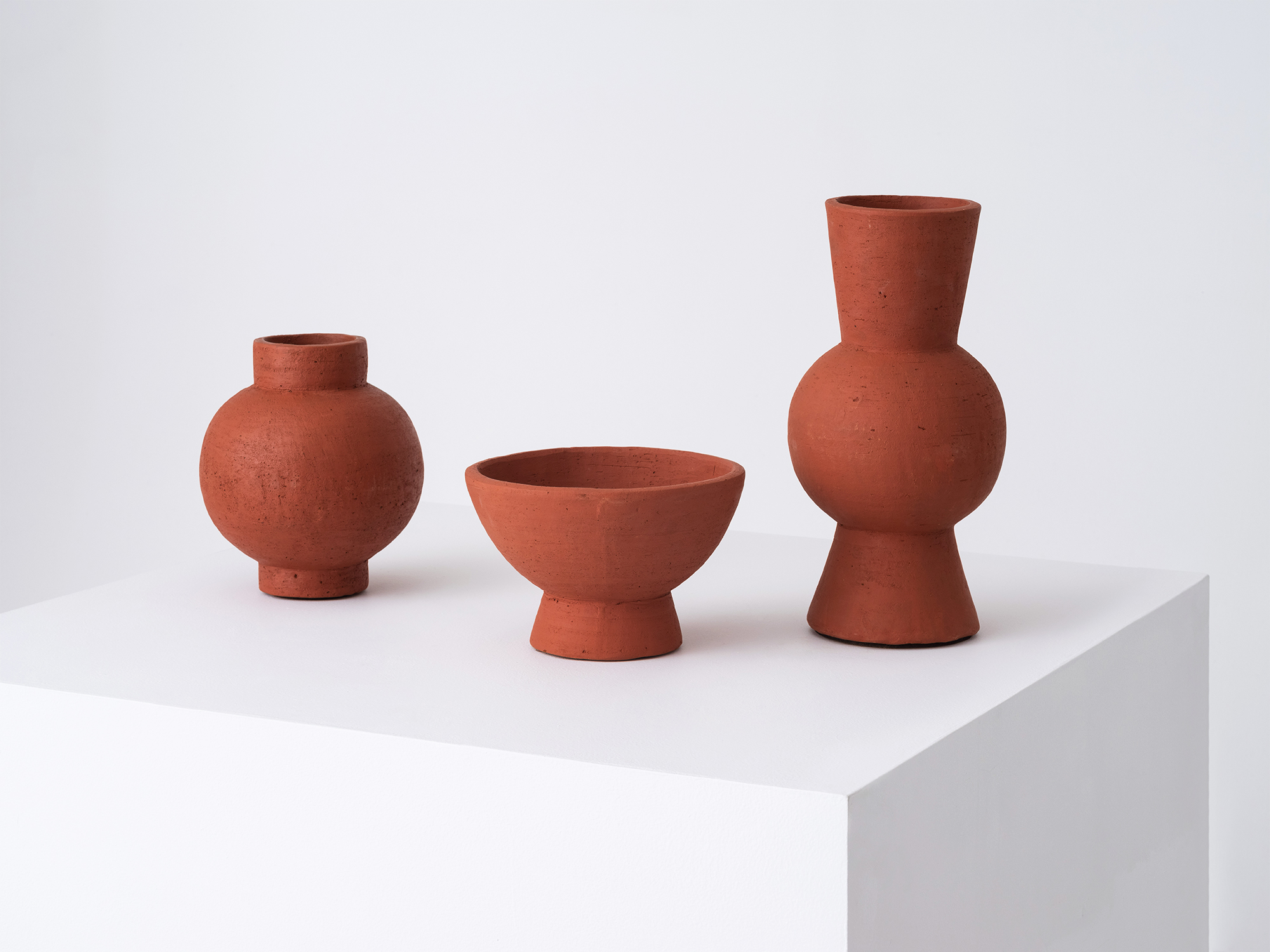 The Terracotta Tall Vase with the bowl and round versions