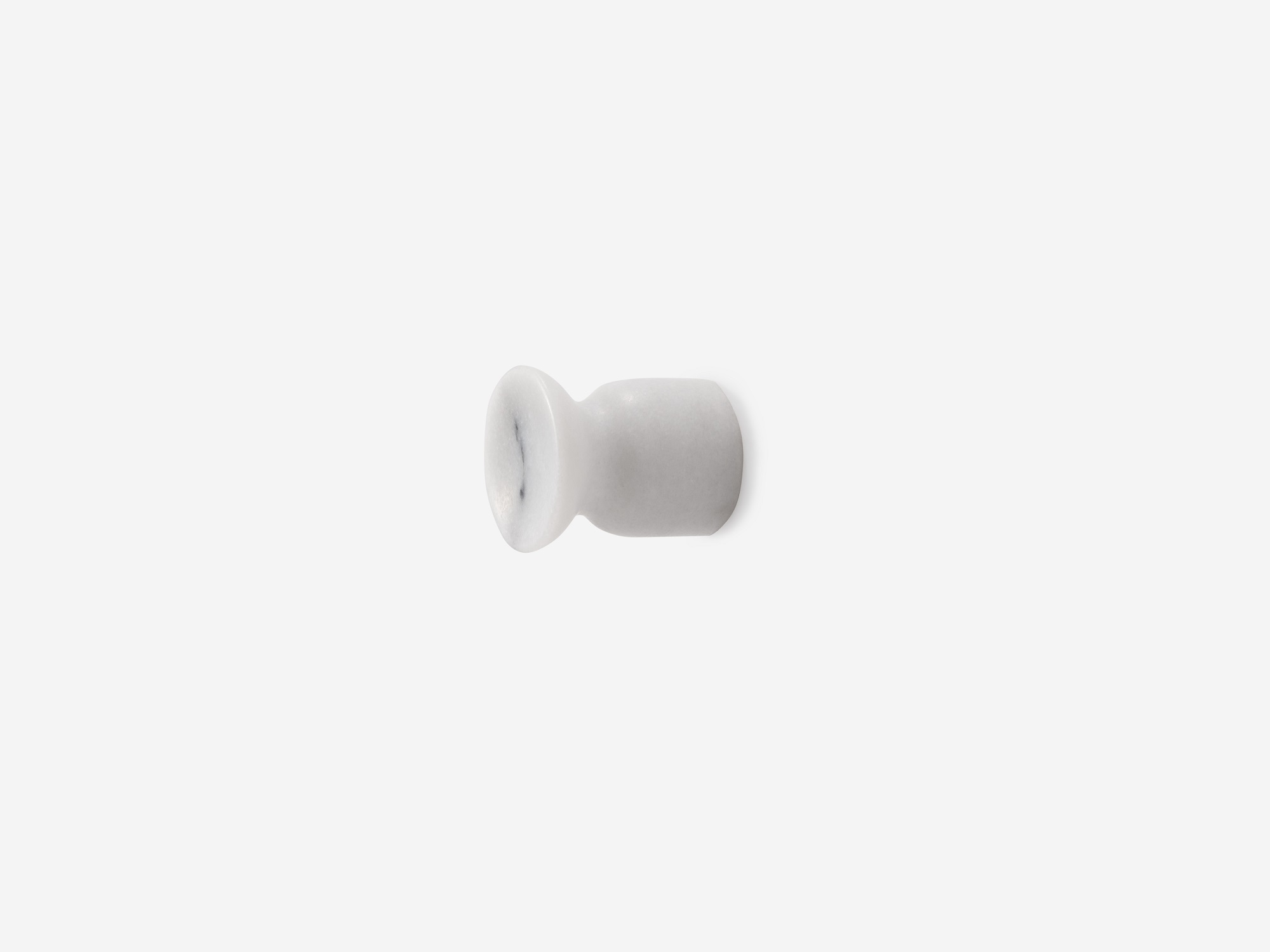 Small white marble coat hook angled view