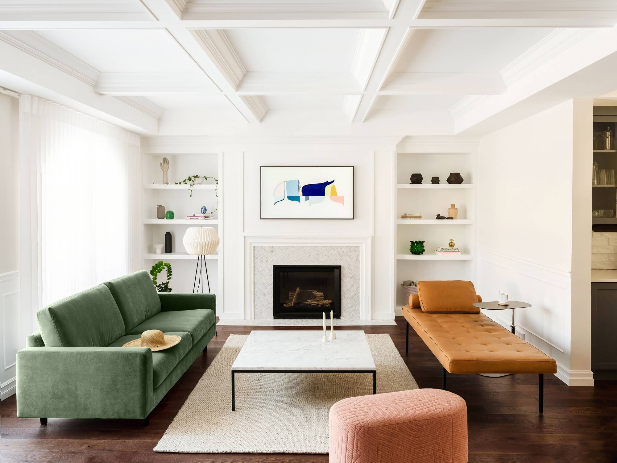 Brown leather daybed with green sofa in modern living space