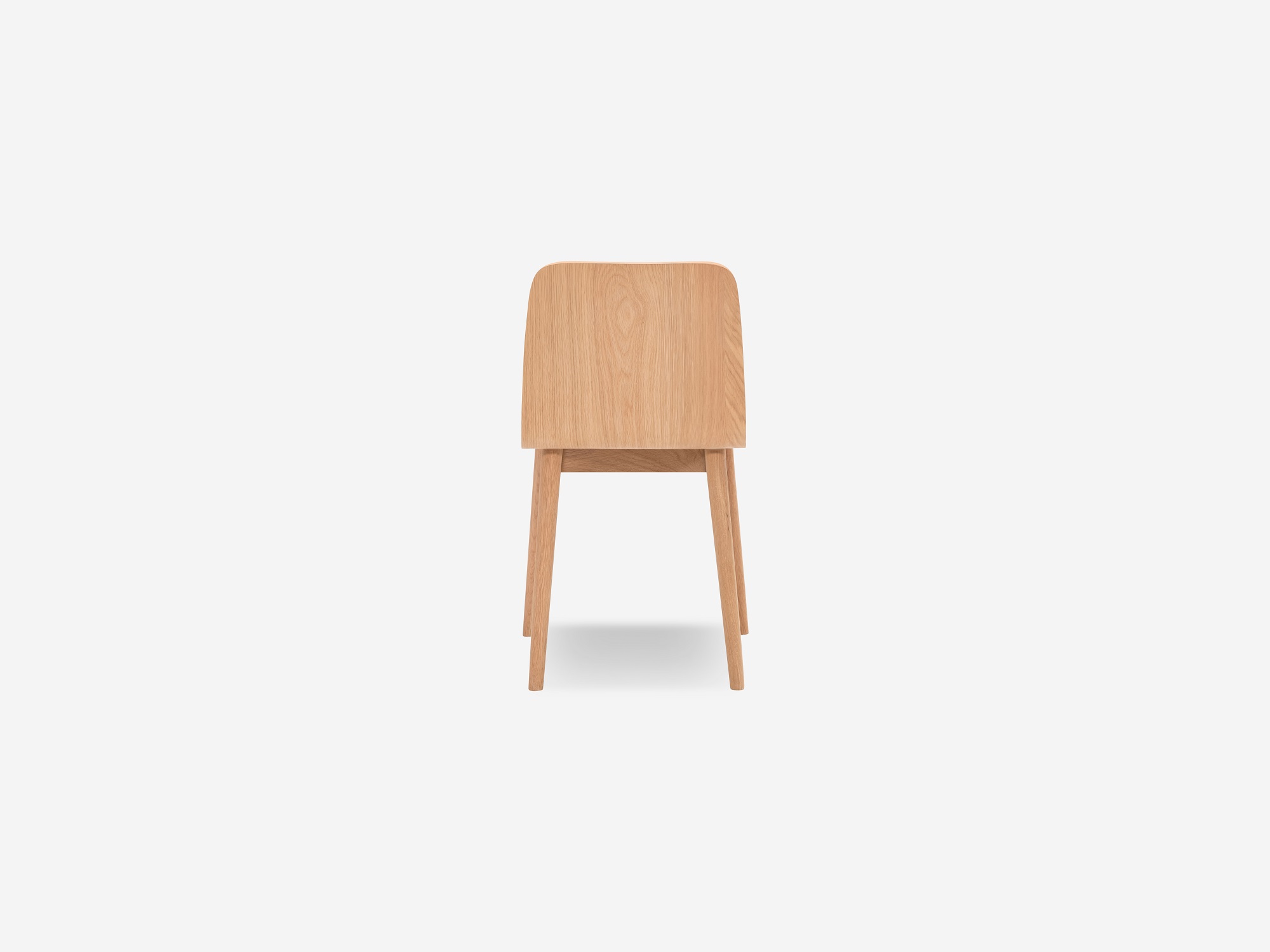 Back angled view of the Tami mid century dining chair in light oak