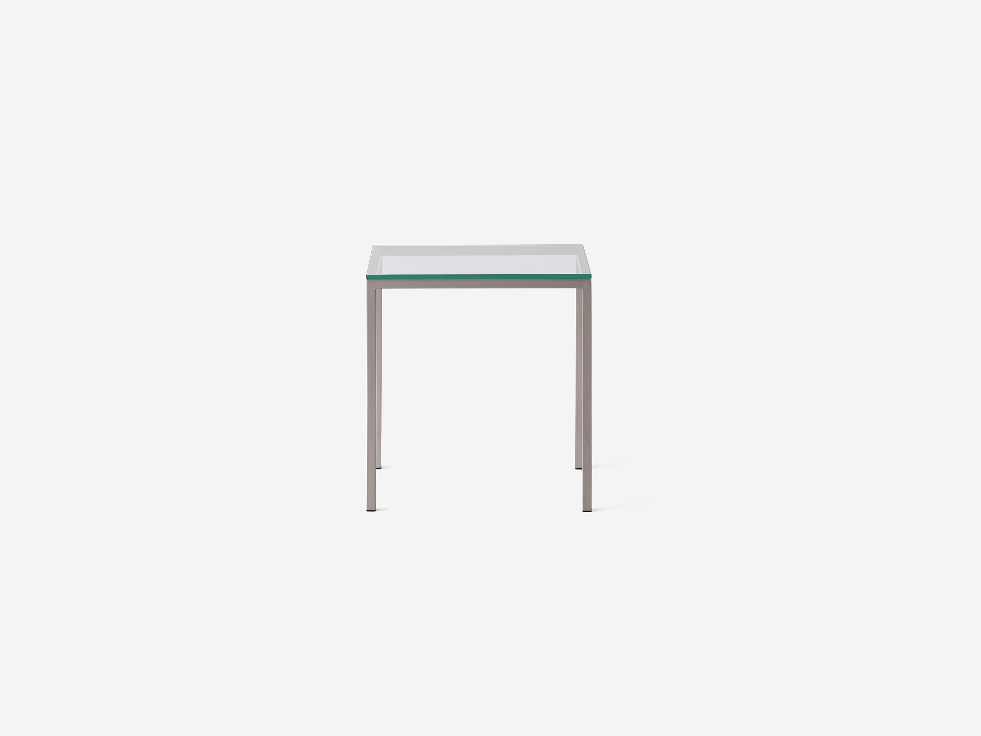 Glass top and stainless steel end table front view