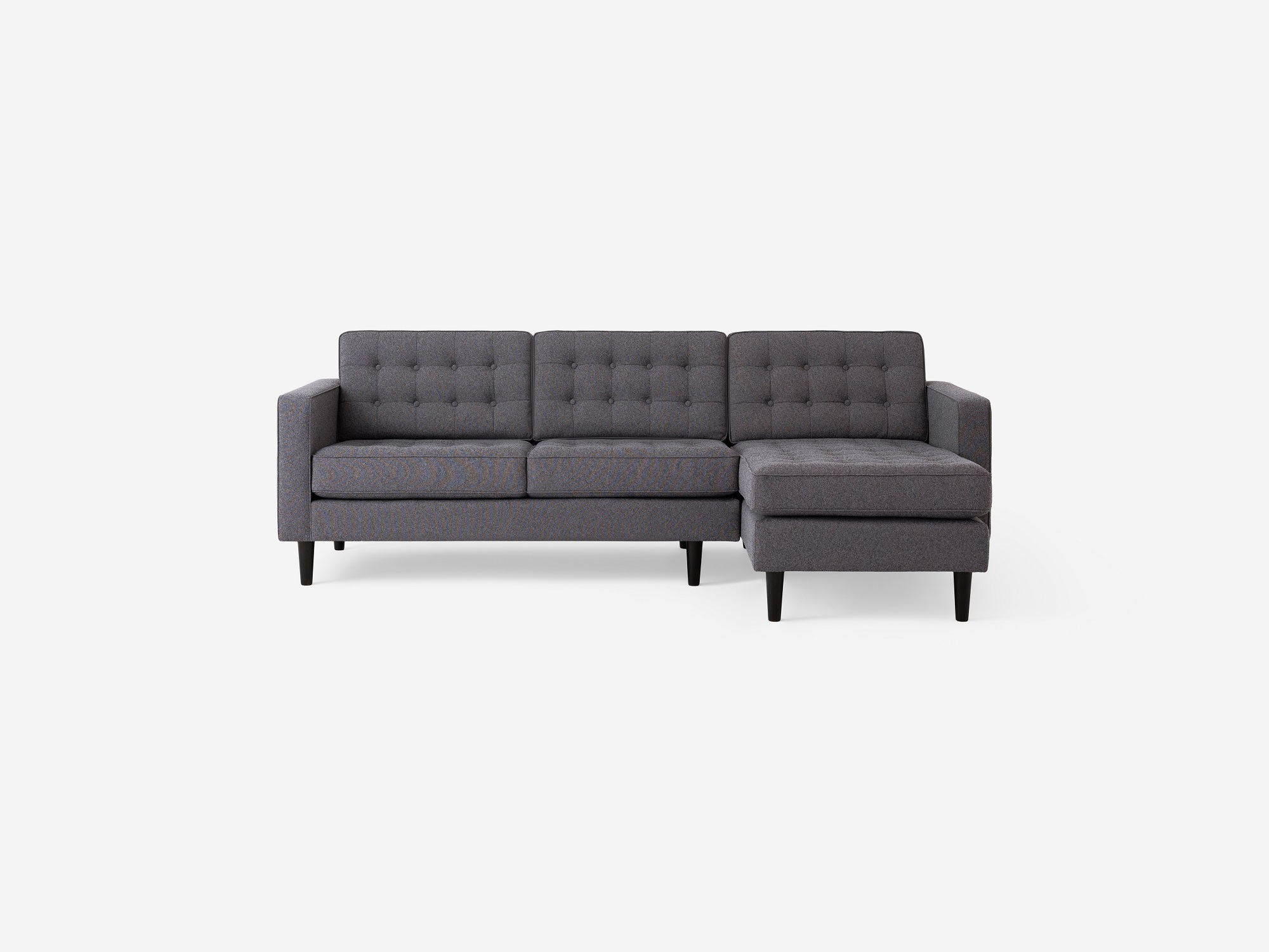 Front view of the  Reverie mid-century sectional sleeper couch in grey fabric