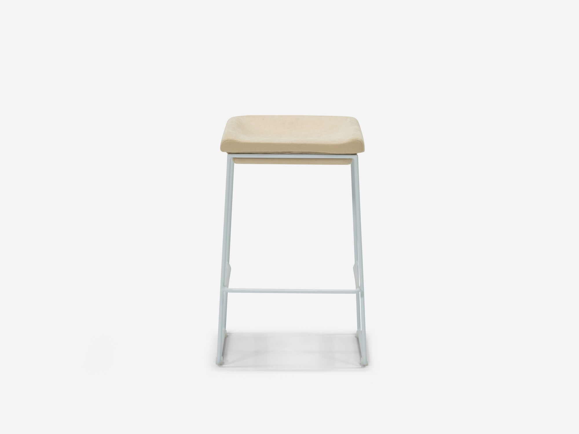 Front view of counter stool with beige seat and white legs