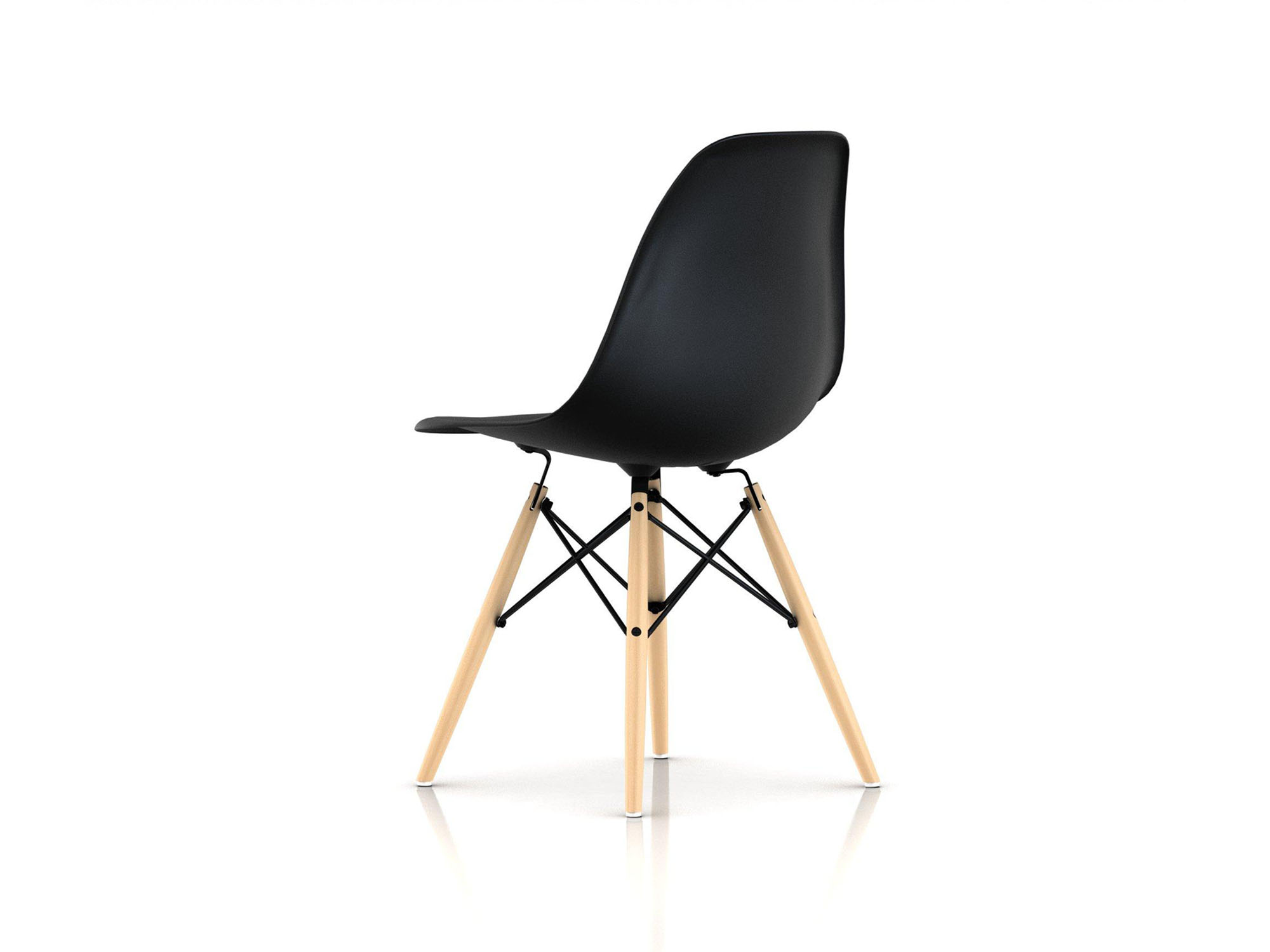 Back angle view of black chair with oak dowels and black wire