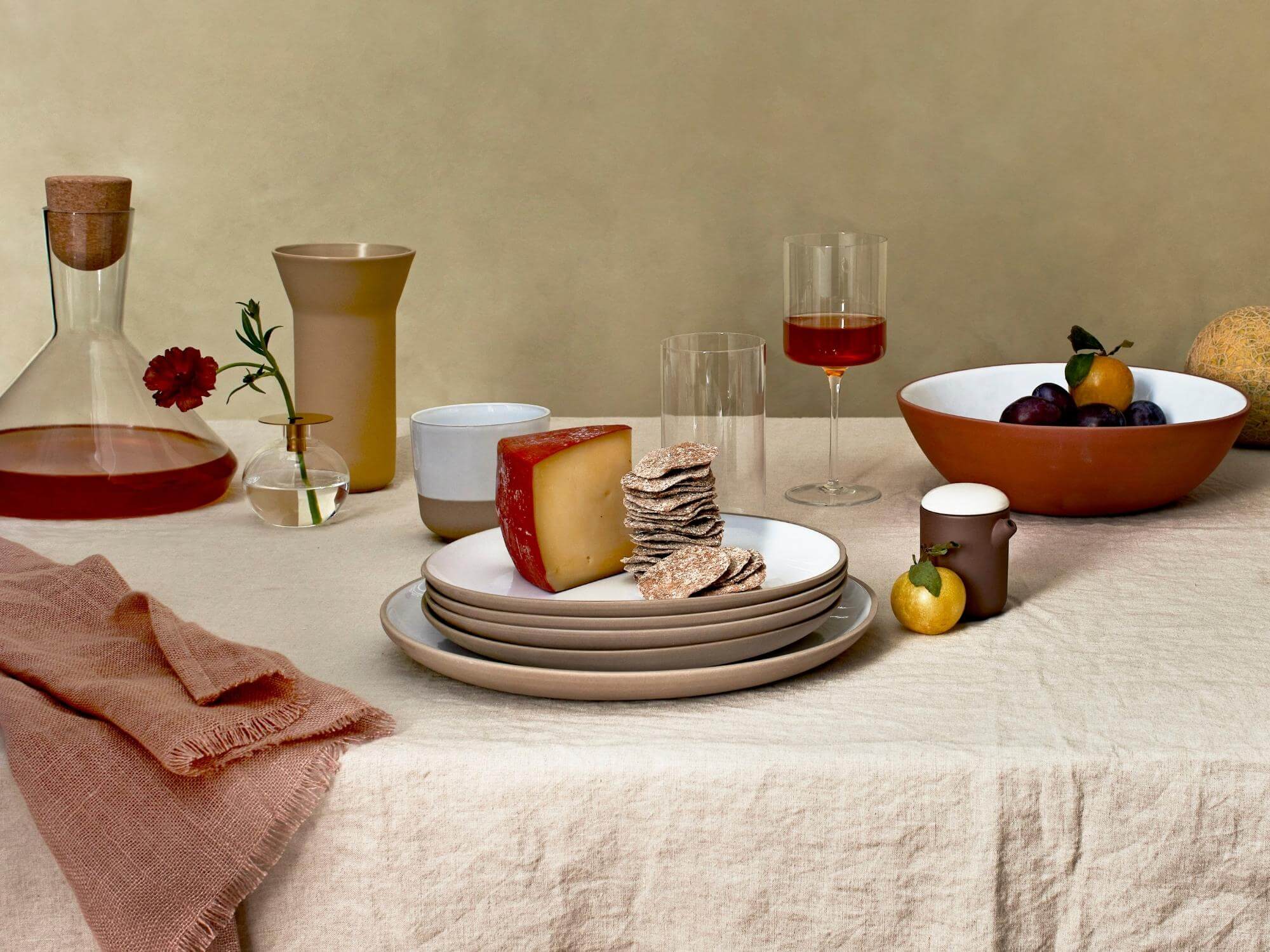 Gray and white dinner plates on expandable dining table