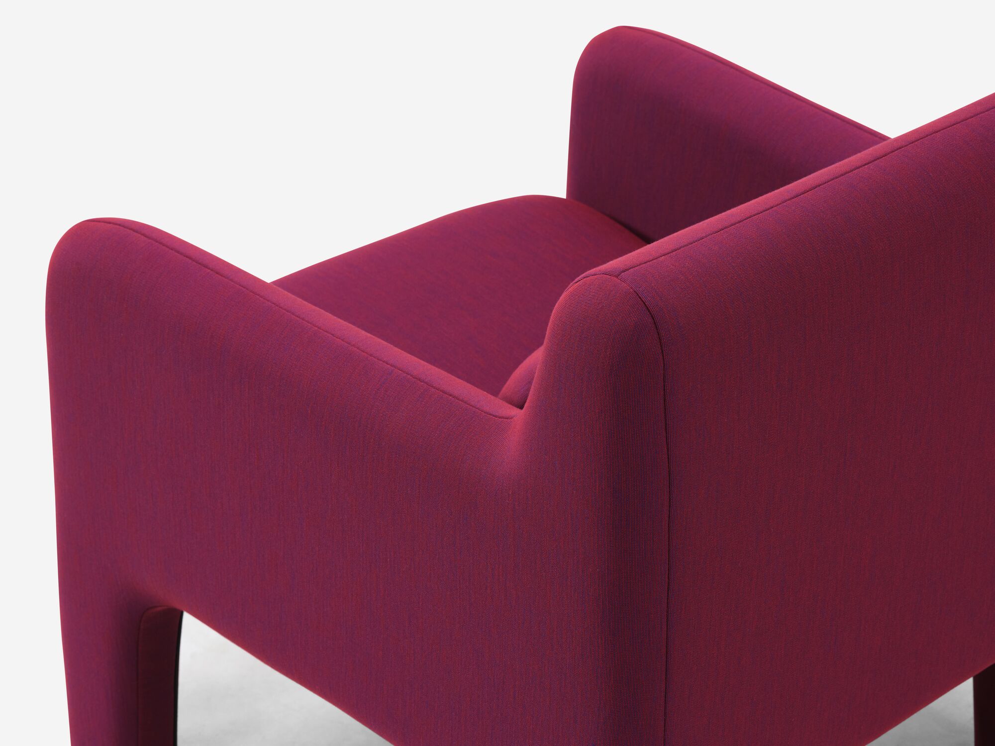 Back detail view of organic shaped red armchair
