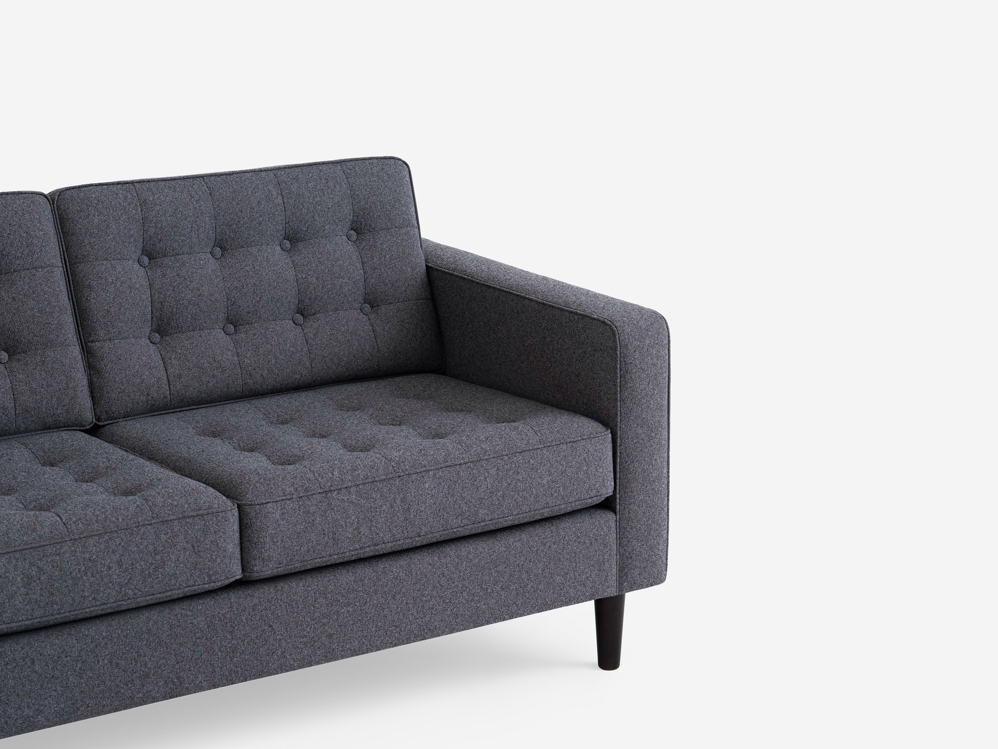 Detail view of the  Reverie modern sectional sofa in grey fabric with left hand facing chaise