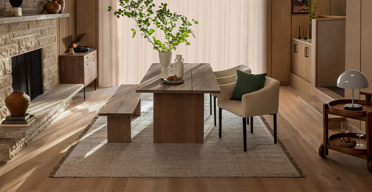 Solid walnut table with a bench and chairs create a dining room setting. Link to dining category