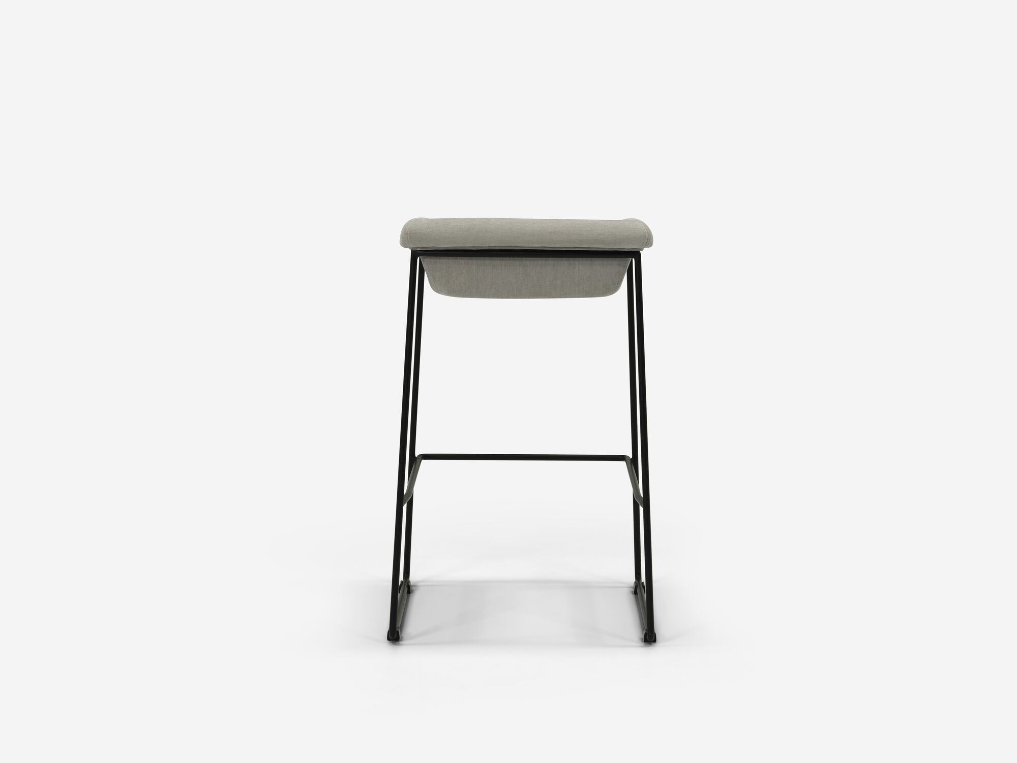 Back view of counter stool with grey seat and black legs