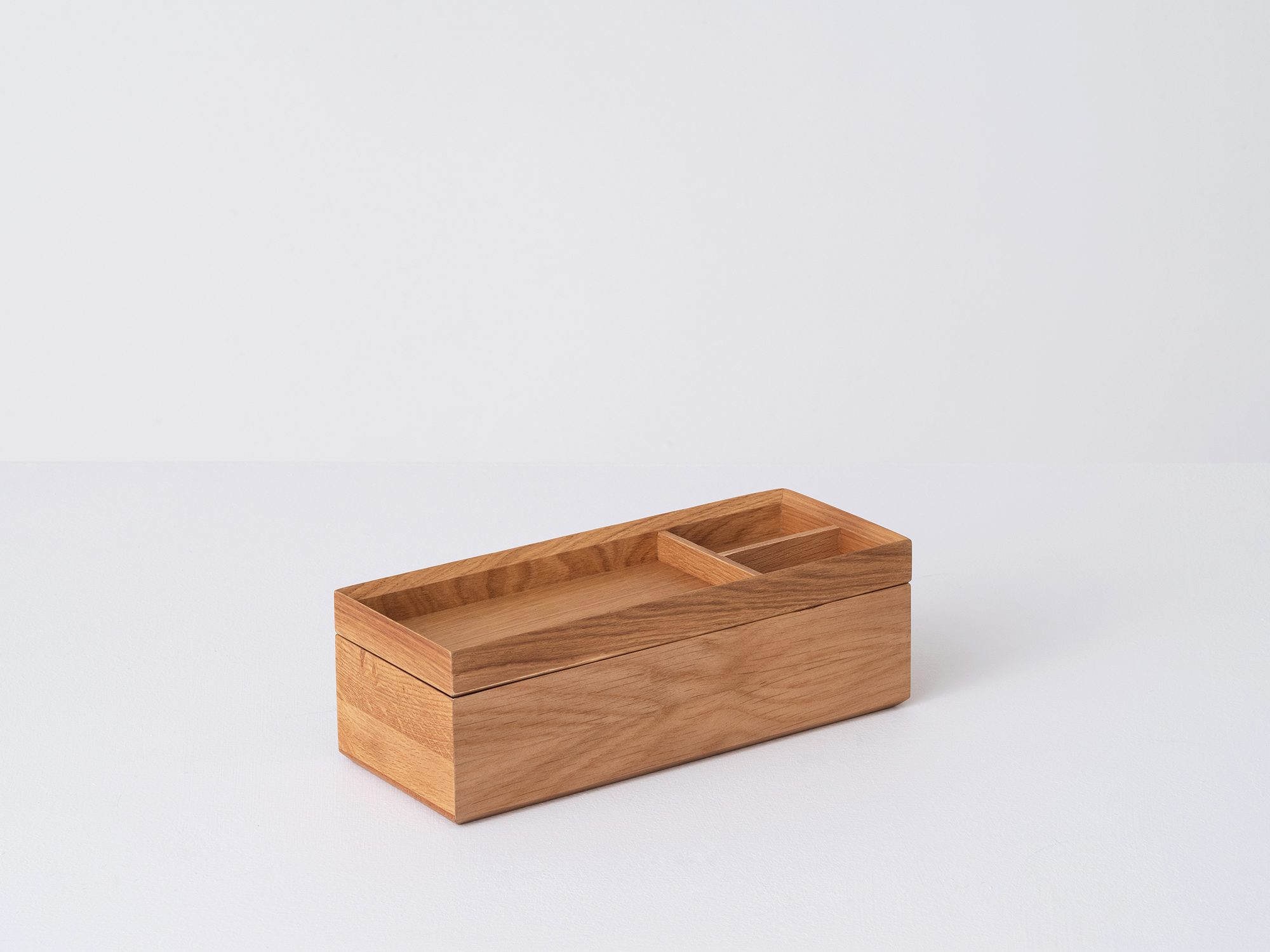 Angled view of the large Draft Pencil Box in oak