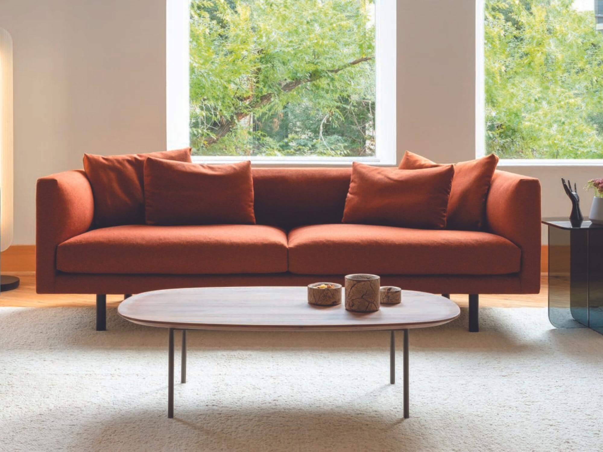 Orange sofa in bright mid century inspired living room