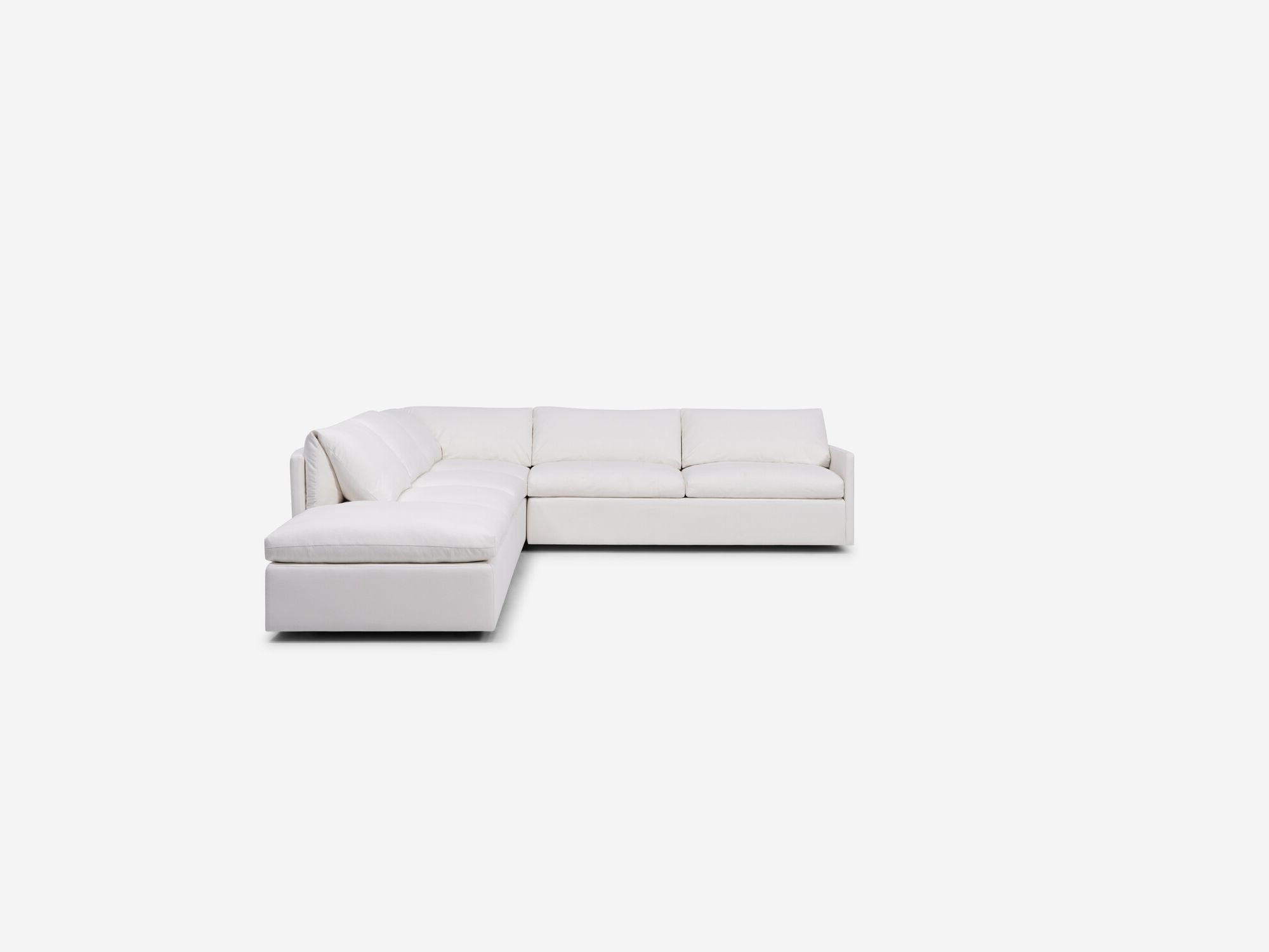 White sectional sofa with narrow arms and left hand chaise front view