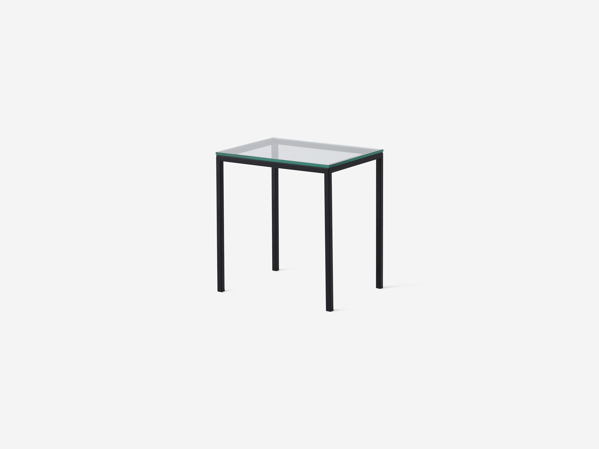 Front angle view of glass top and black end table