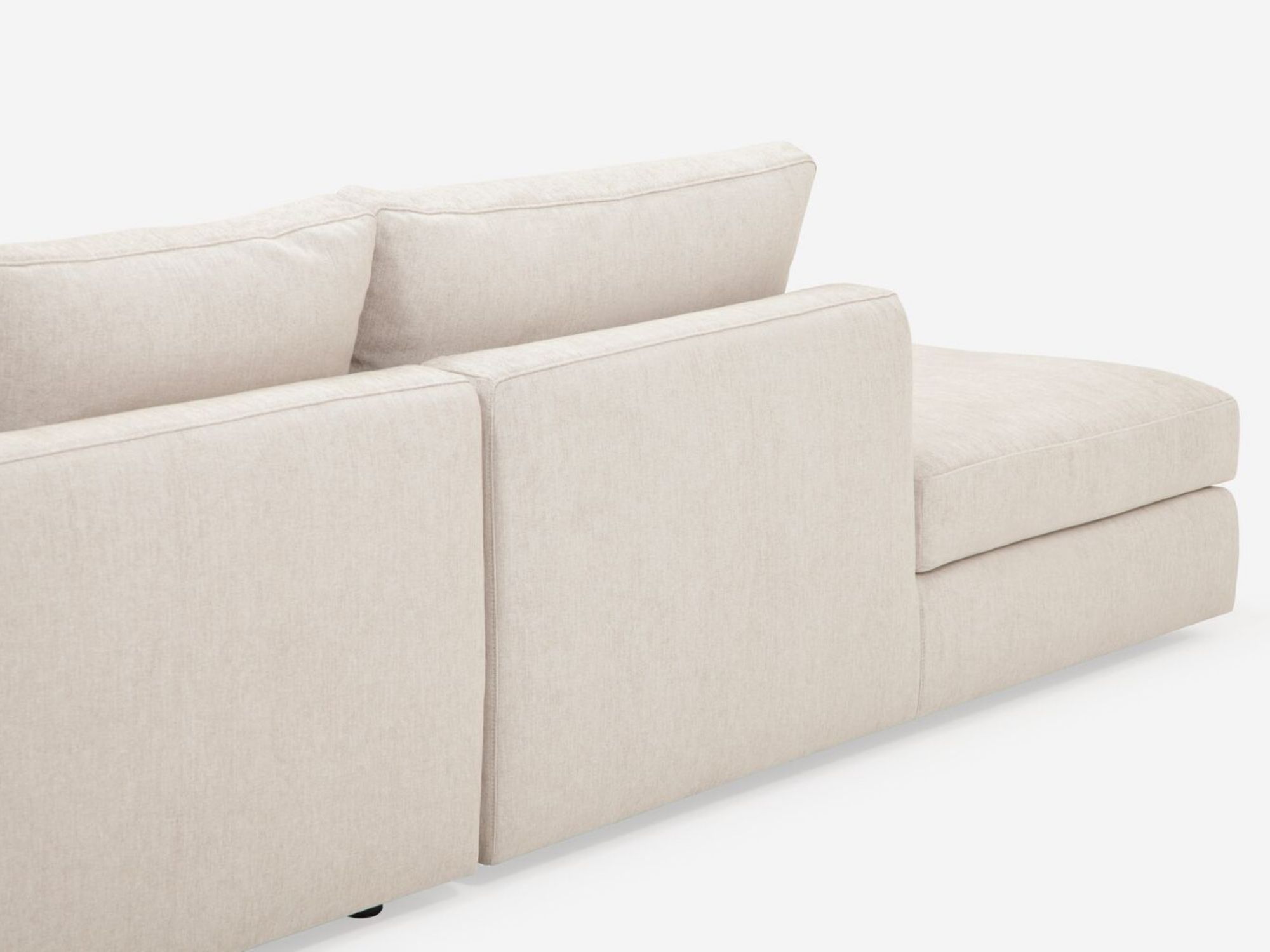 Back view of the Cello modern sectional couch in white fabric with left hand backless chaise