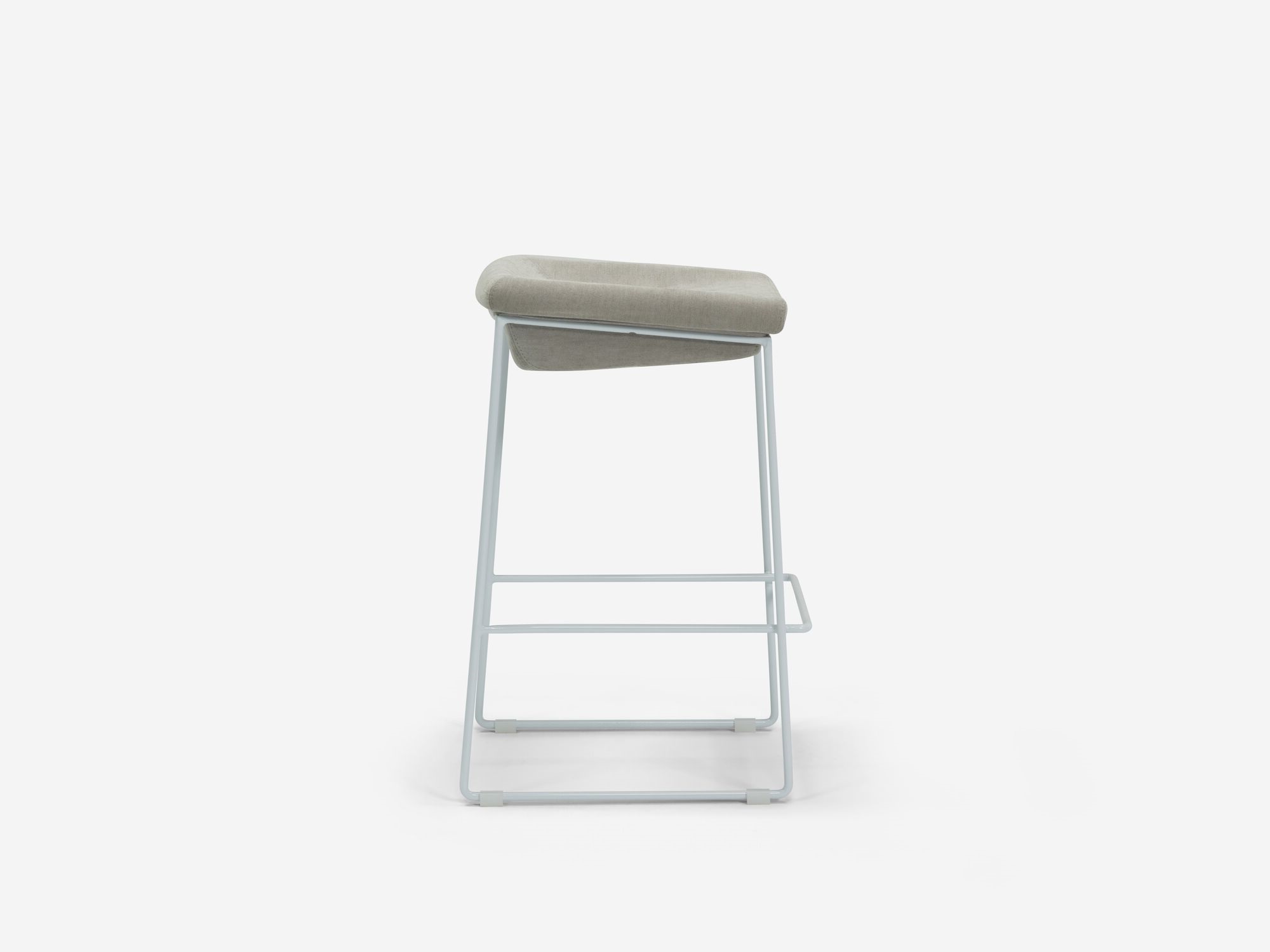 Side view of counter stool with grey seat and white legs