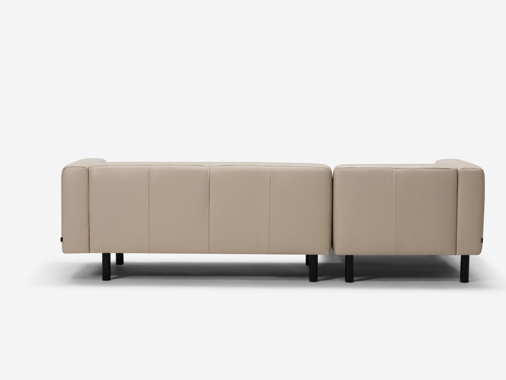 Back angle view of beige leather sectional