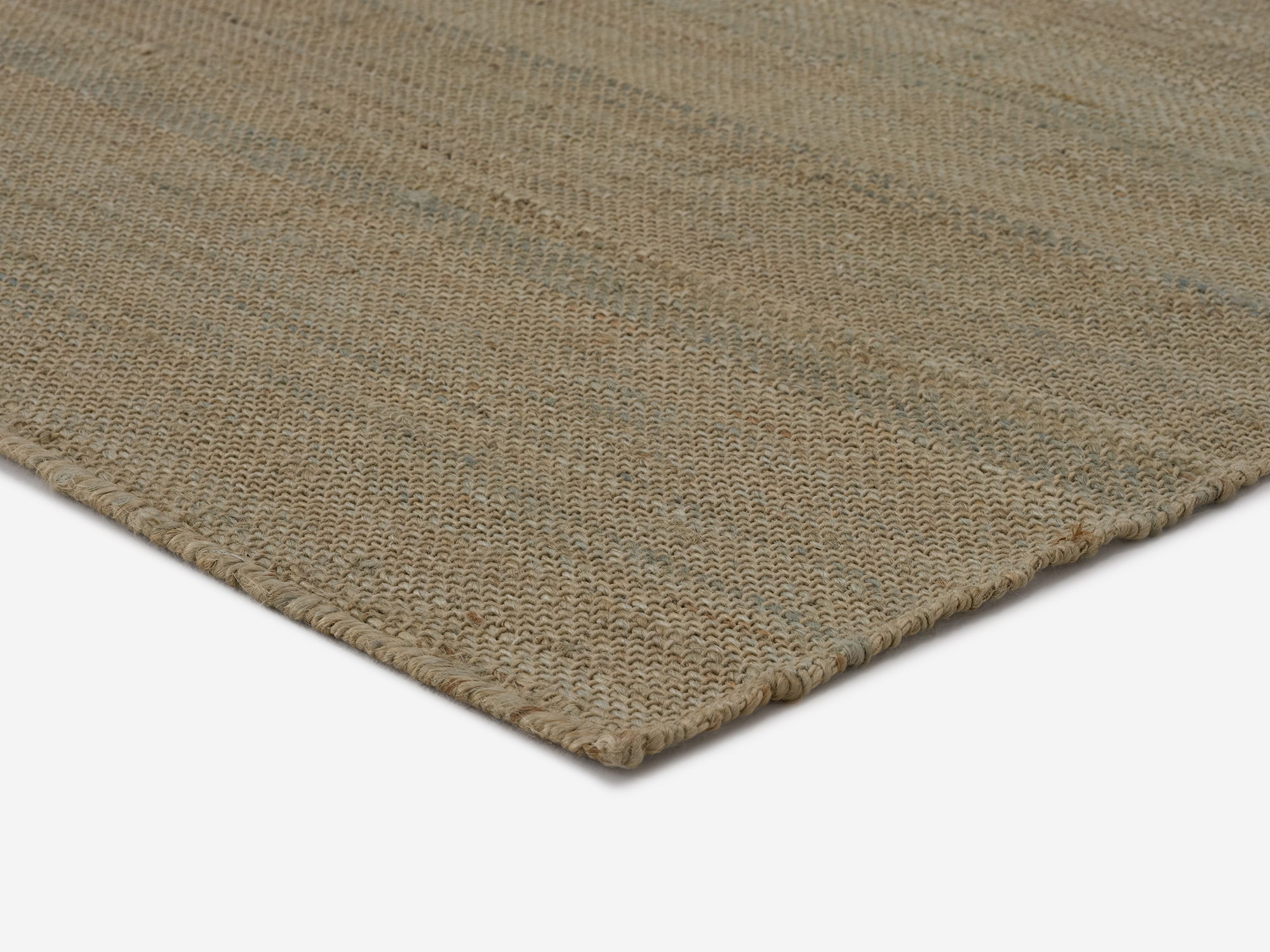 Corner view of green hand woven jute large rug