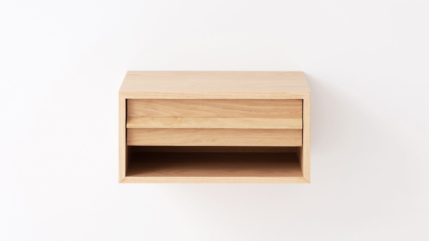 Front view of the Marcel open shelf floating nightstand in oak