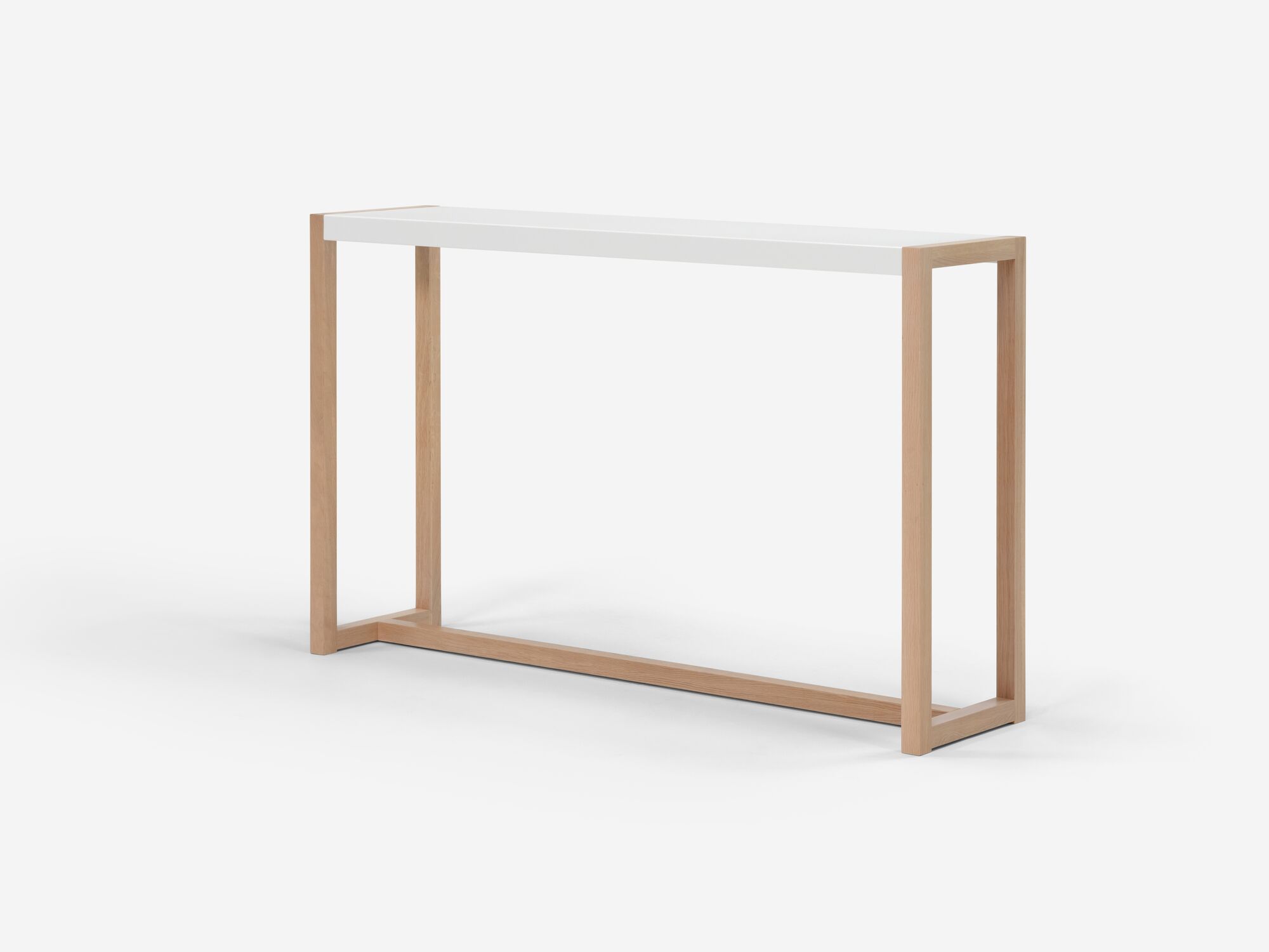 Angle view of white and oak console table