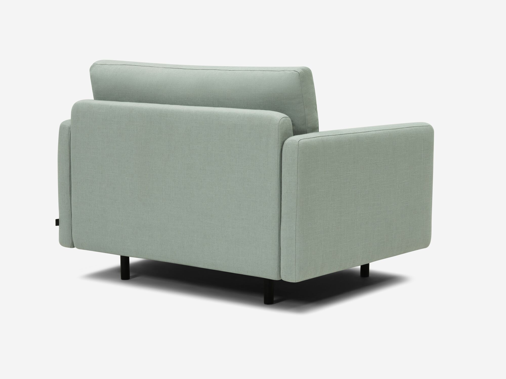 Wide teal armchair back angle view
