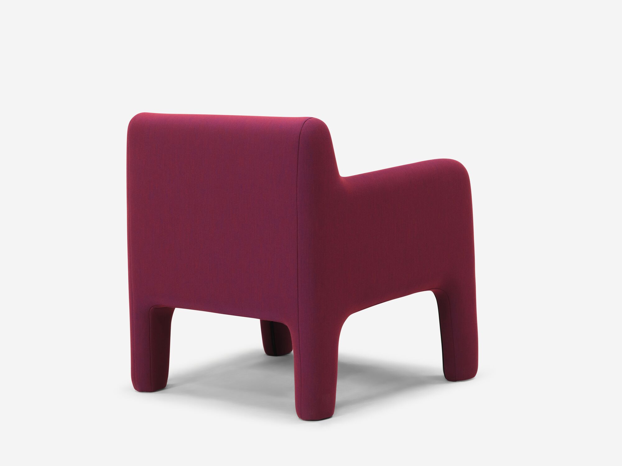 Organic shaped red armchair back angle view
