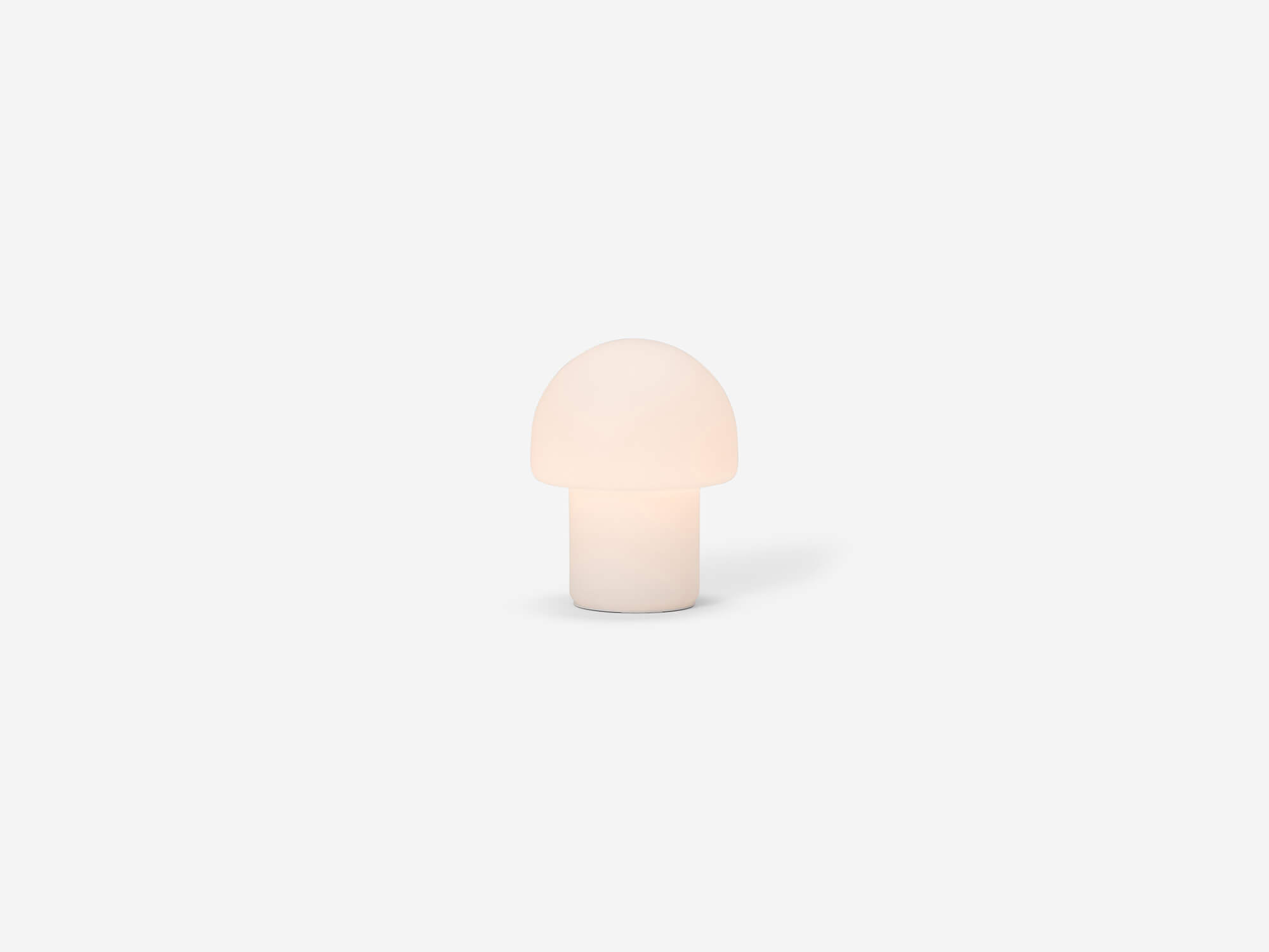 Small mushroom shaped table lamp with light on