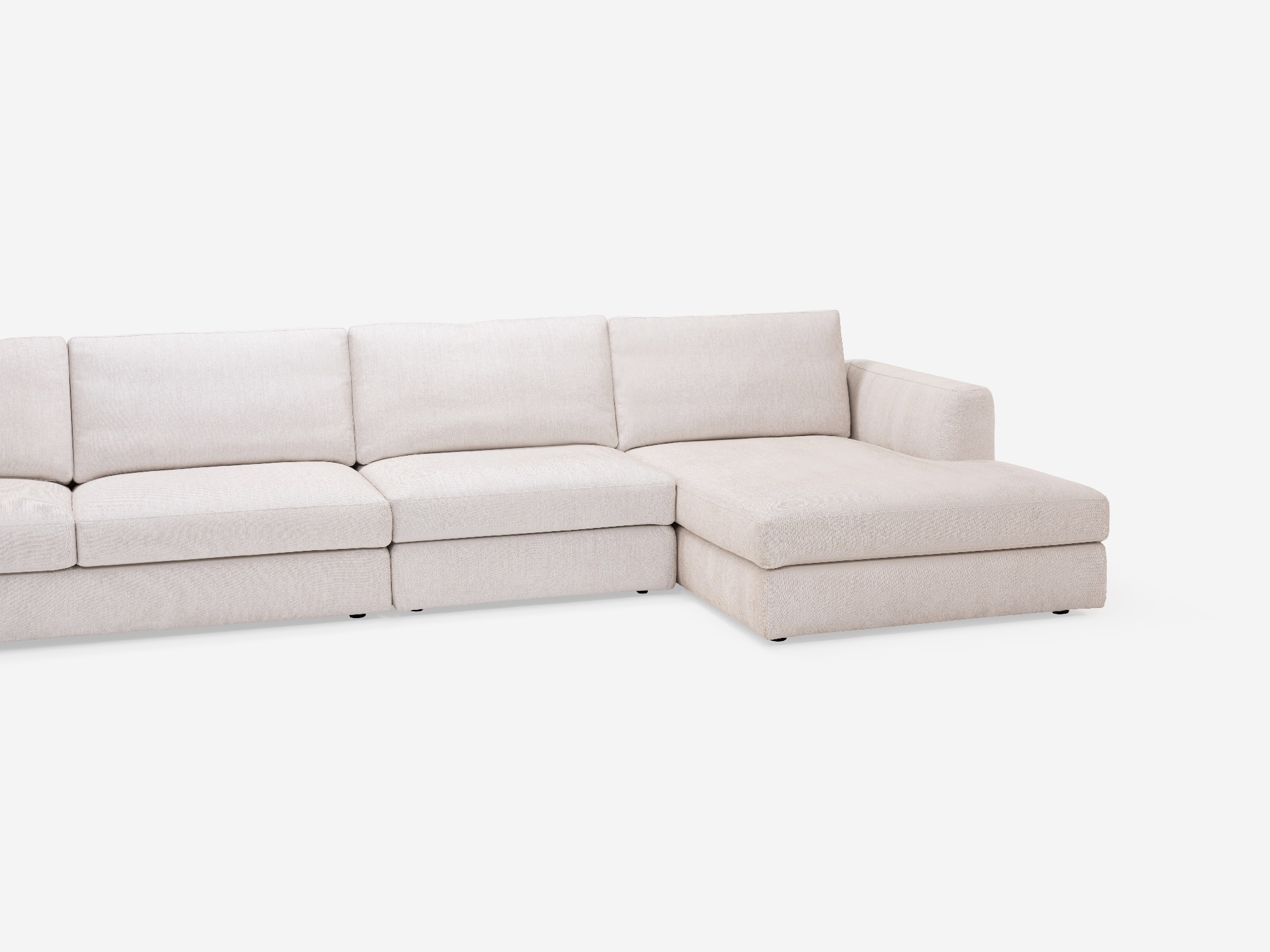 Detailed view of the modern sectional couch in white fabric with right hand chaise