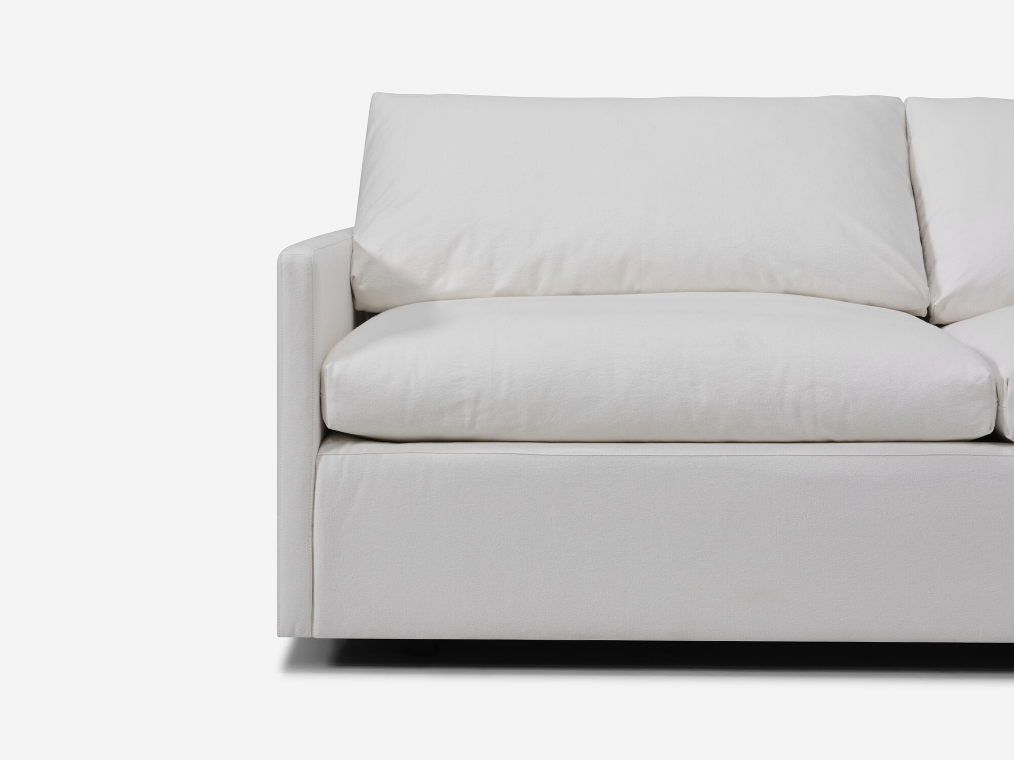 White sectional sofa with narrow arms and right hand chaise seat view