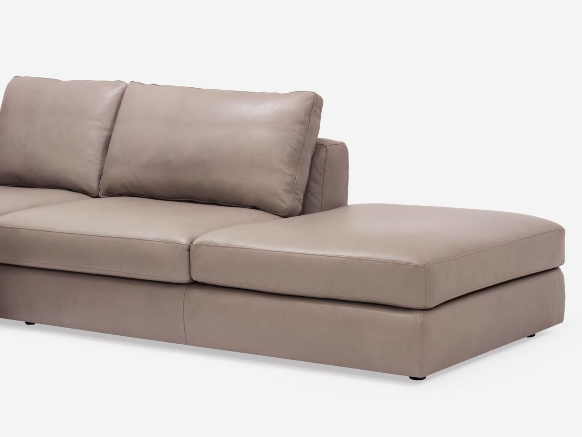 Detail chaise view of the Cello modern sectional couch in beige leather