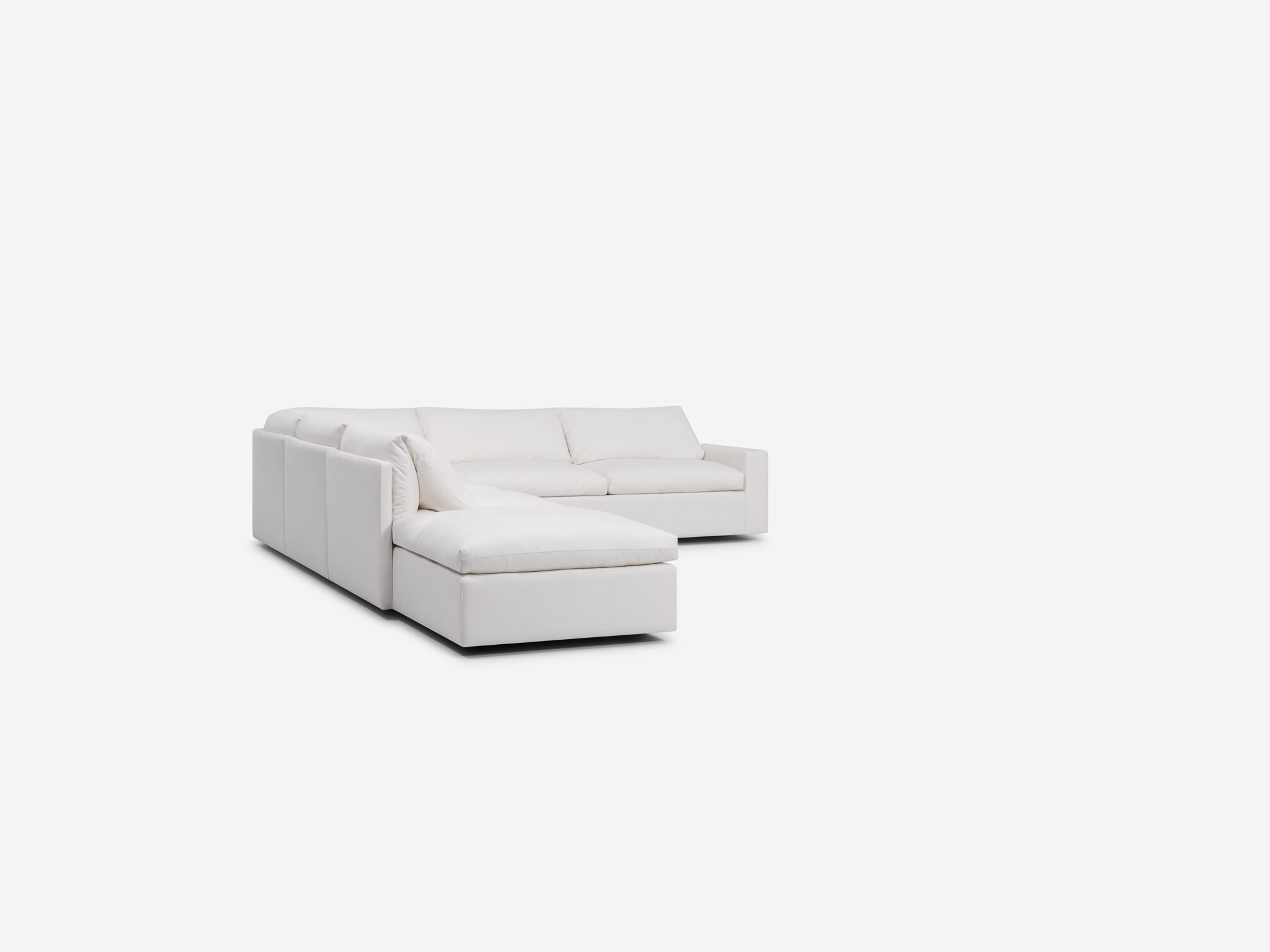 Left angle view of white sectional sofa with left hand chaise