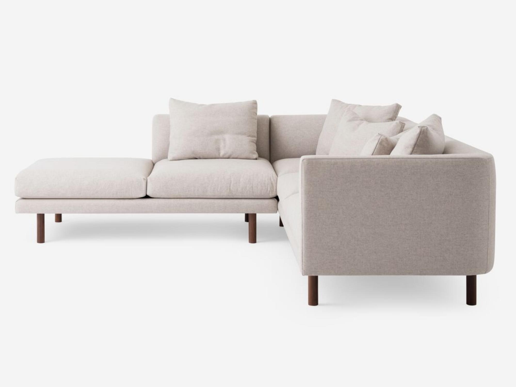 Side view of the Replay modern sectional upholstered in beige fabric