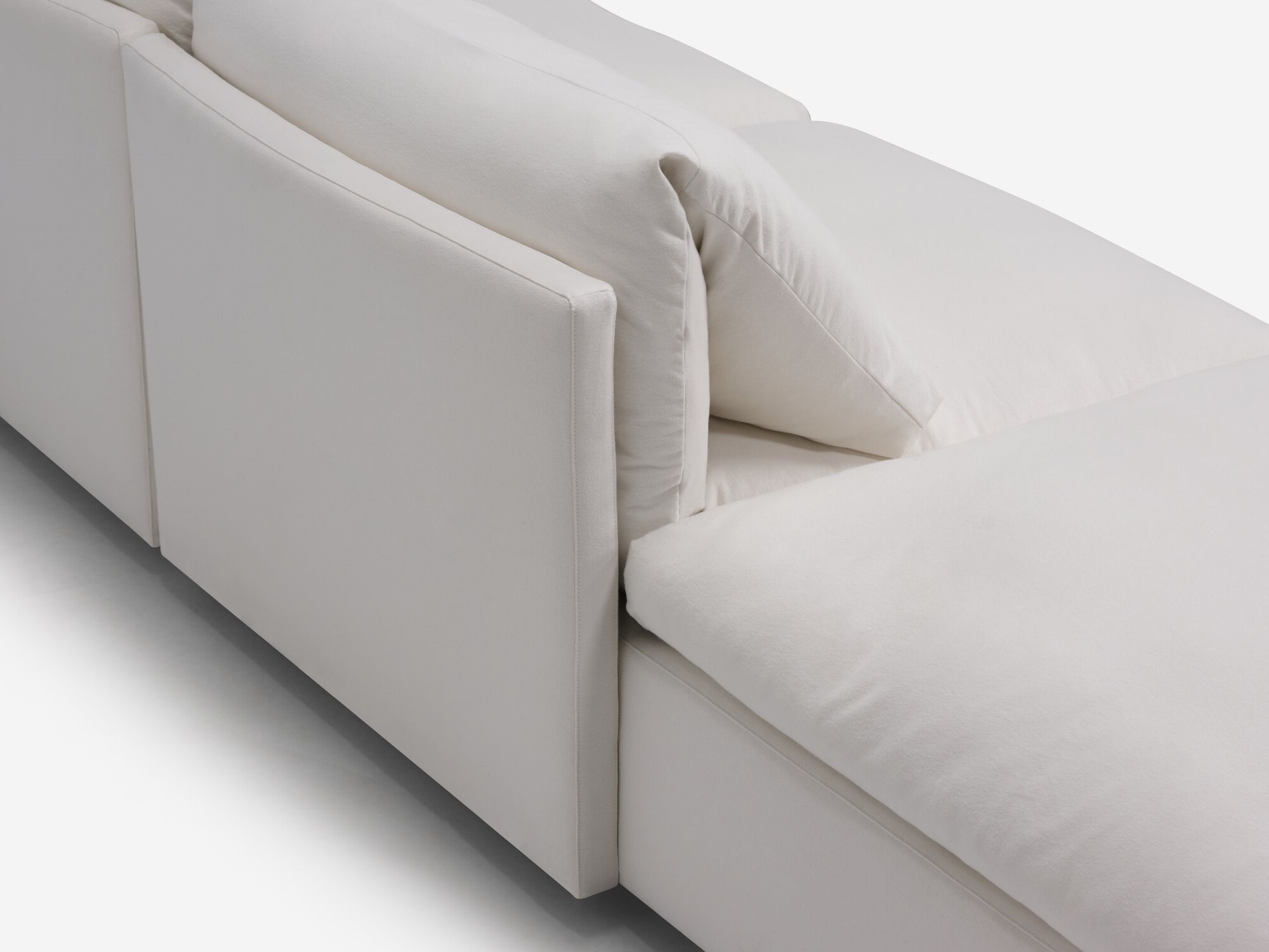 Back detail view of white sectional sofa