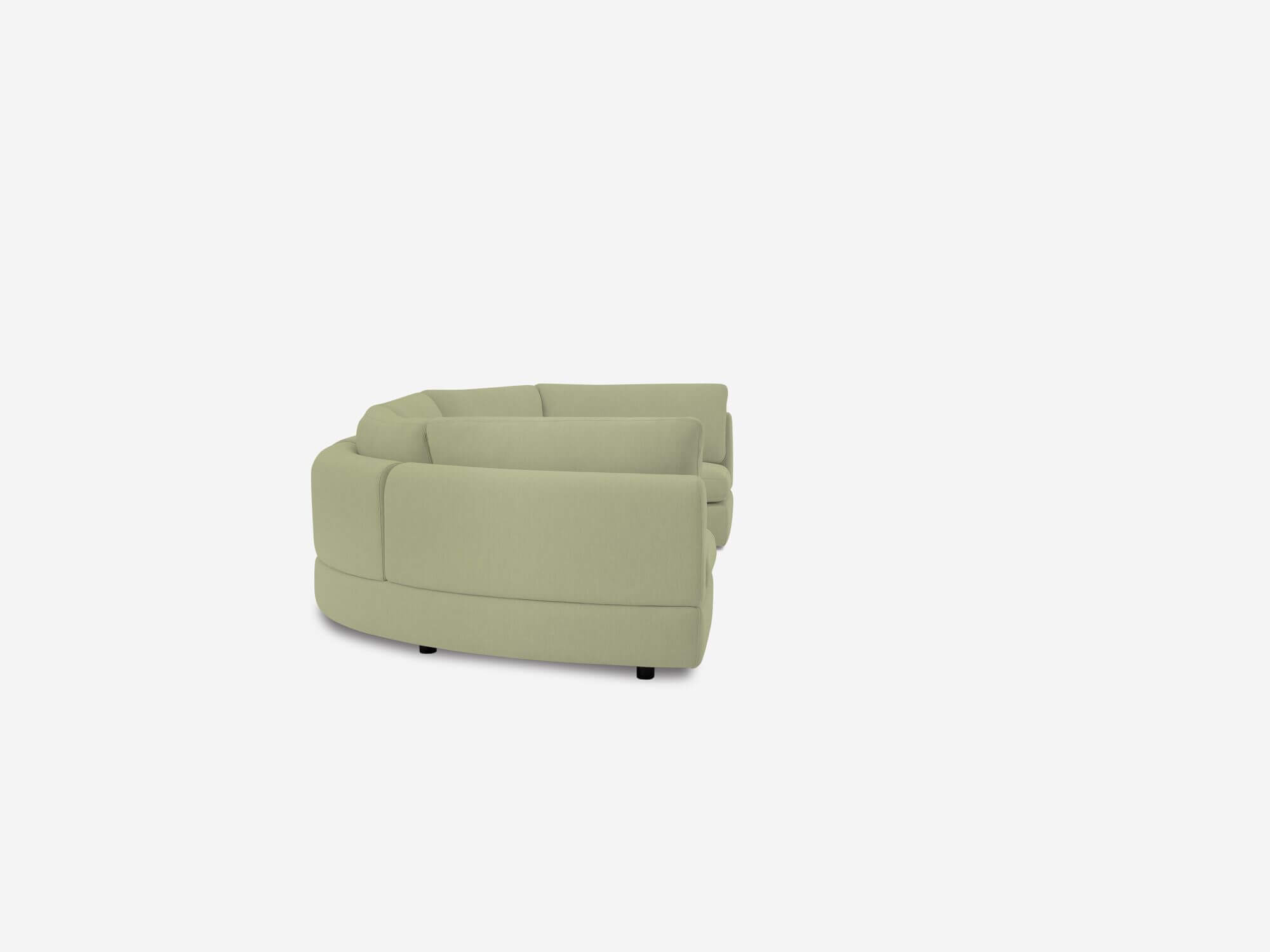 Side view of light green curved sectional sofa