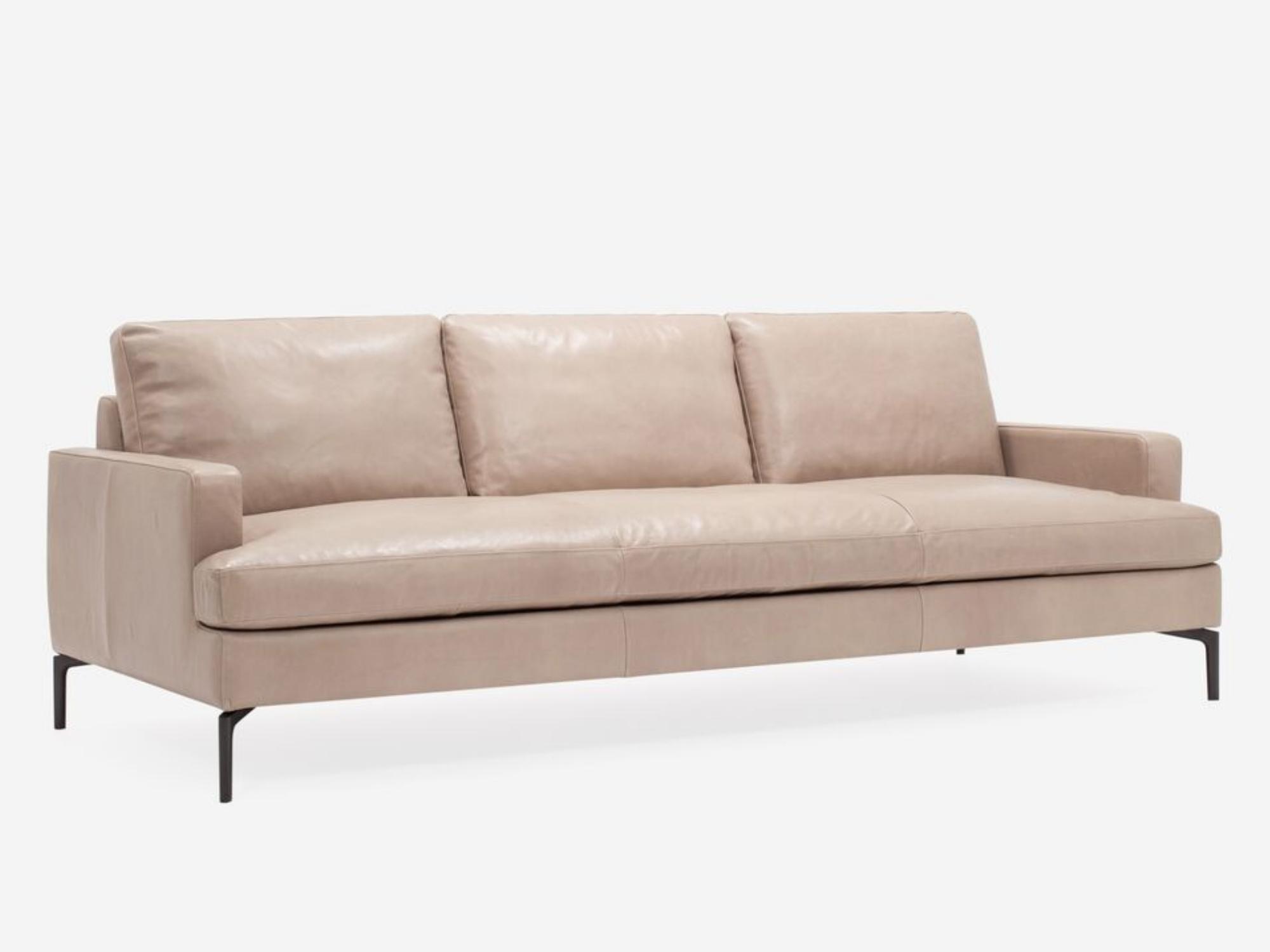 Right corner view of the mid century modern Eve Sofa in beige leather