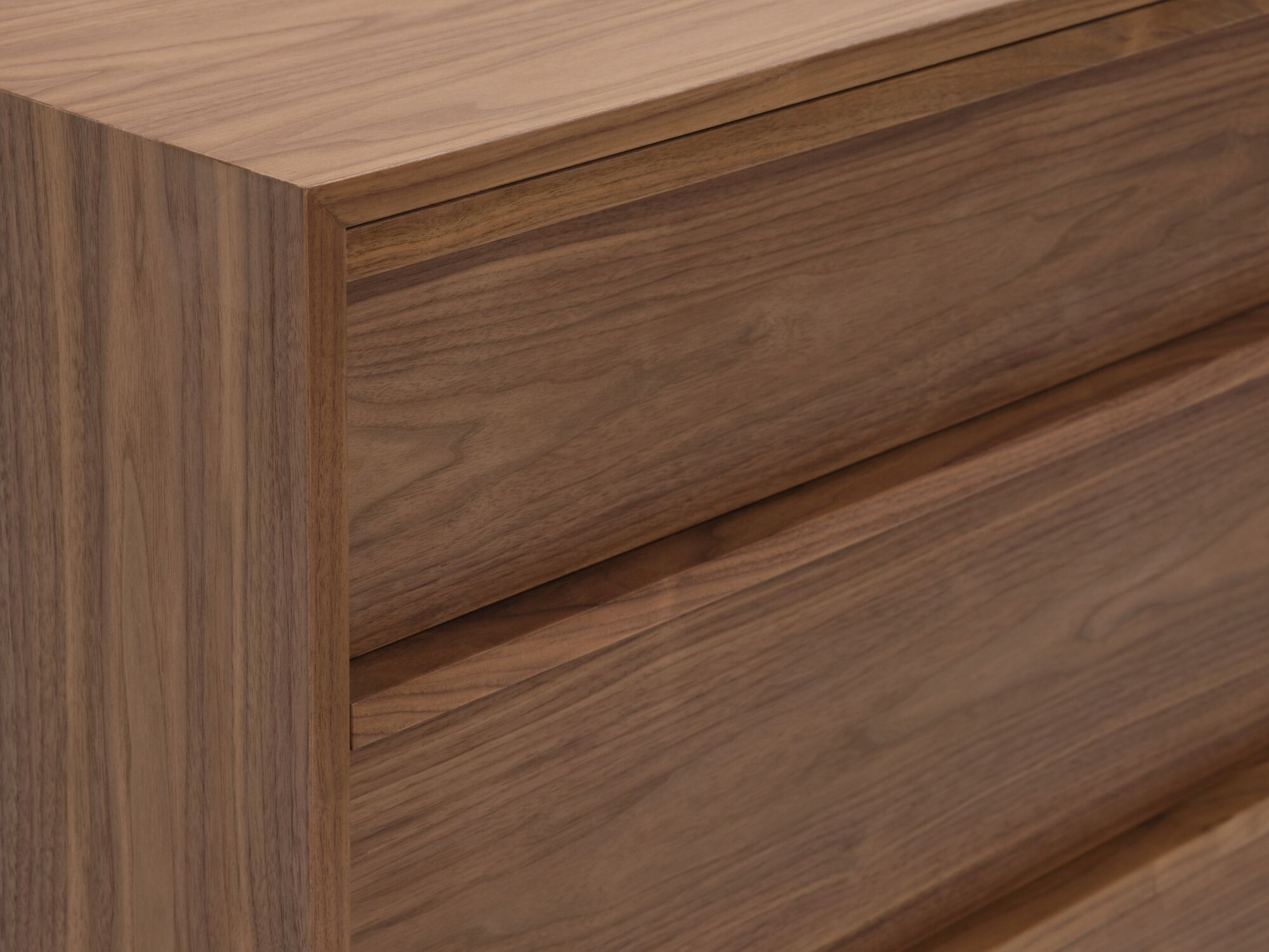Detail corner view of modern walnut single dresser